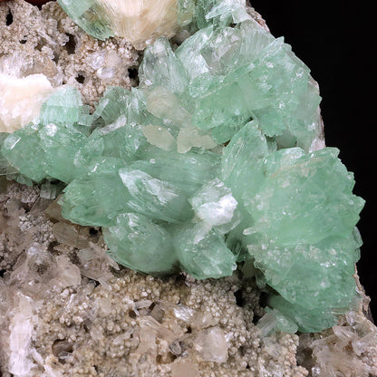 Apophyllite Green Crystal with Stilbite Natural Mineral Specimen # B3716 https://www.superbminerals.us/products/apophyllite-green-crystal-with-stilbite-natural-mineral-specimen-b-3716 A very aesthetic piece featuring a matrix densely coated with miniature, Stilbite crystals with a couple of lustrous, larger light Stilbite crystals on matrix, all hosting a line of transparent, mint-green Apophyllite pseudocubic (rectangular) crystals ascending to the top of the piece. Great contrast,