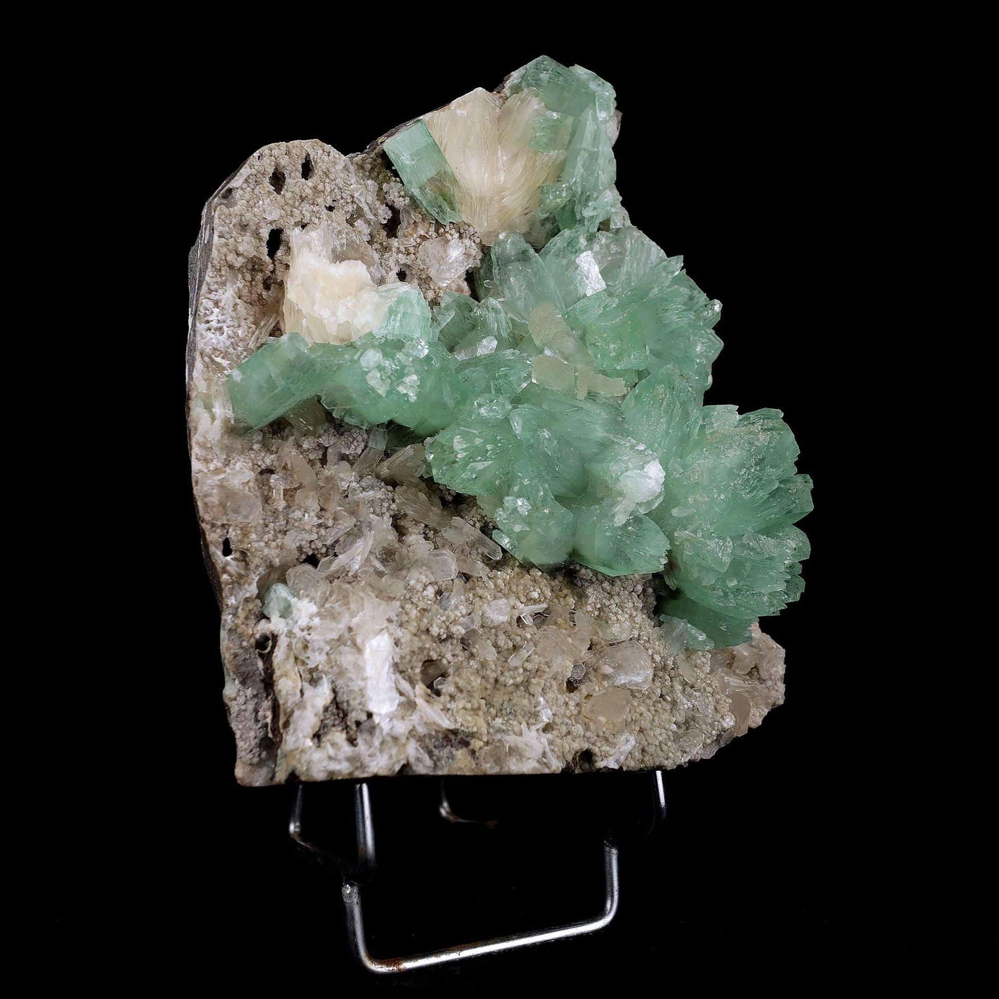 Apophyllite Green Crystal with Stilbite Natural Mineral Specimen # B3716 https://www.superbminerals.us/products/apophyllite-green-crystal-with-stilbite-natural-mineral-specimen-b-3716 A very aesthetic piece featuring a matrix densely coated with miniature, Stilbite crystals with a couple of lustrous, larger light Stilbite crystals on matrix, all hosting a line of transparent, mint-green Apophyllite pseudocubic (rectangular) crystals ascending to the top of the piece. Great contrast,