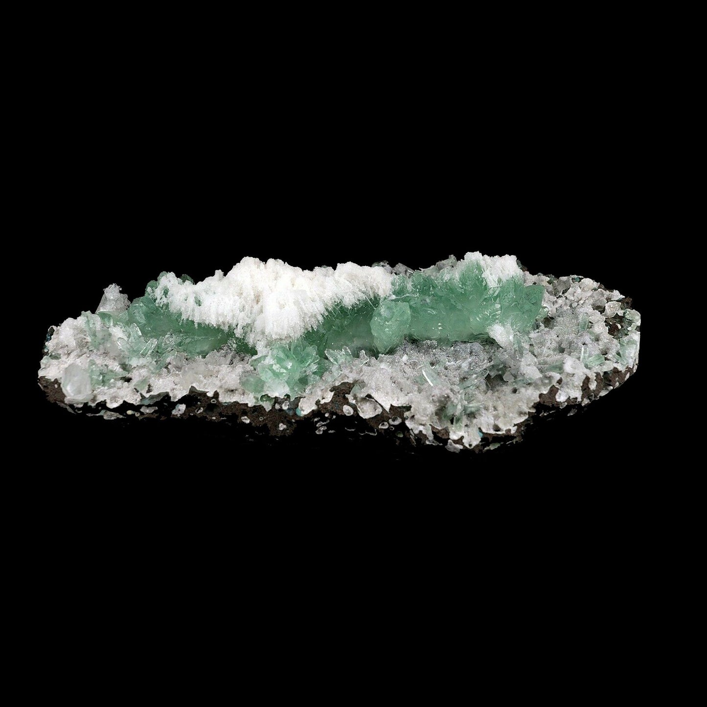 Apophyllite Green with Scolecite on Chalcedony Attention Grabber # B 3…  https://www.superbminerals.us/products/apophyllite-green-with-scolecite-on-chalcedony-attaintion-graber-b-3744  Features:A very aesthetic piece featuring a matrix densely coated with miniature, sparkling mint crystals with a numerous of lustrous, larger light-green to green Apophyllite crystals on white chalcedony matrix, all hosting a line of transparent, mint-green Apophyllite pointed crystals ascending to the top of the piece