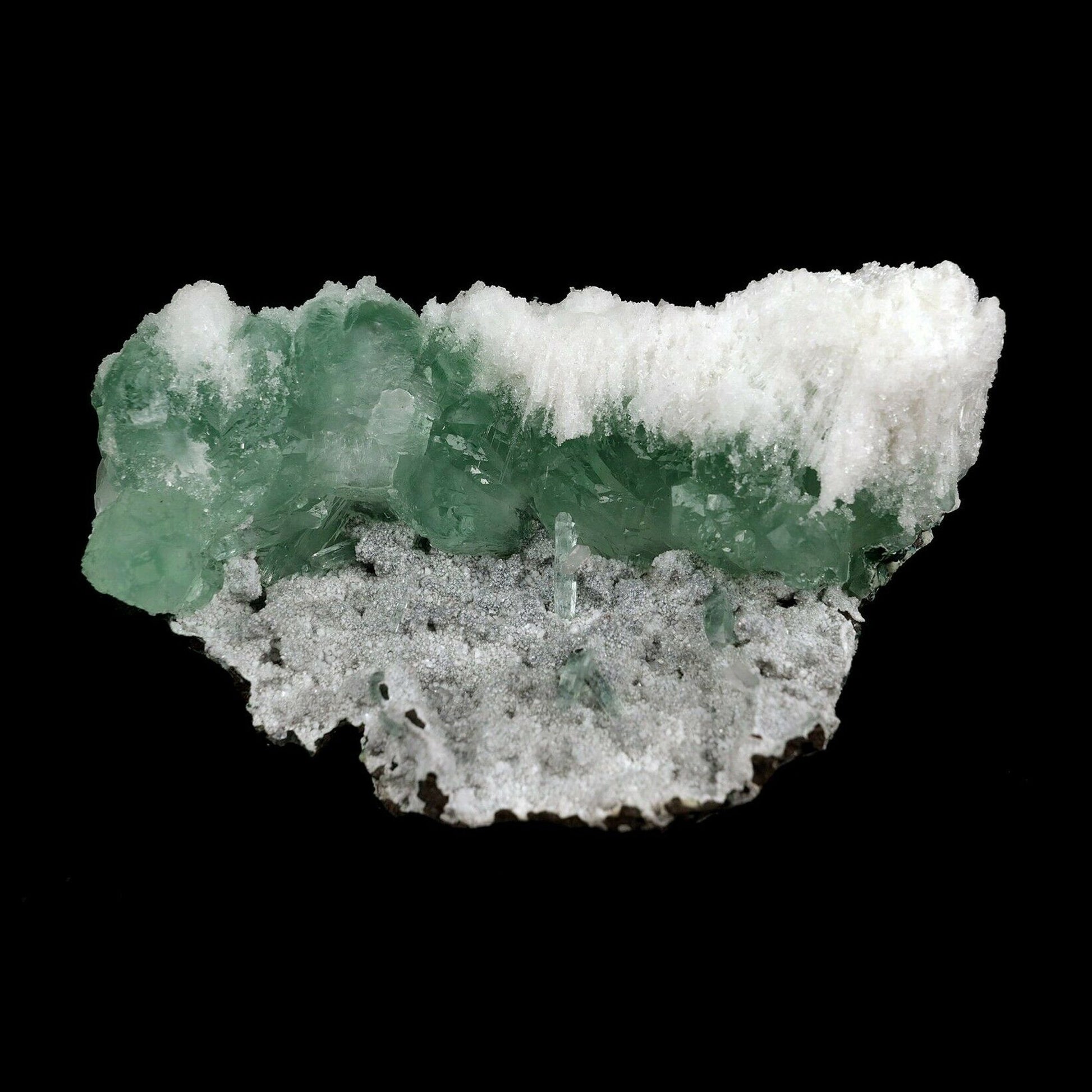 Apophyllite Green with Scolecite on Chalcedony Natural Mineral Specimen B3738 https://www.superbminerals.us/products/apophyllite-green-with-scolecite-on-chalcedony-natural-mineral-specimen-b-3738 This piece has various gemmy, radiant, straightforward groups of green Apophyllite precious crystals, profoundly pursued for their lucidity and rich green tone, on it various bunches of white, clear scolecite splashes, all on a grid of white, shimmering Chalcedony. An excellent and gaudy piece 
