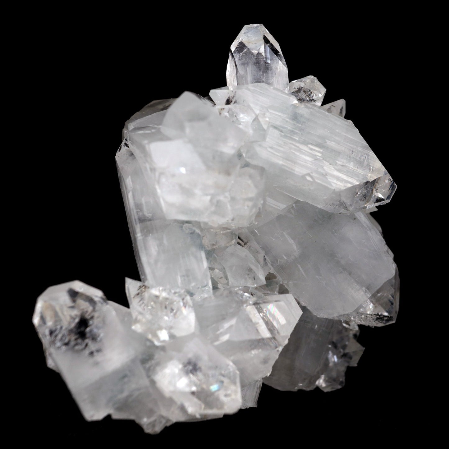 Apophyllite Terminated Sparkling Crystal Natural Mineral Specimen # B …  https://www.superbminerals.us/products/apophyllite-terminated-sparkling-crystal-natural-mineral-specimen-b-3928  FeaturesThis is a beautifully balanced and aesthetic specimen of water clear, transparent Apophyllite. Positioned perfectly in the center of a mass of lustrous Apophyllite crystals, is a large, perfect pyramidal Apophyllite crystal. This piece really stands out, is a great show piece, and has no damage