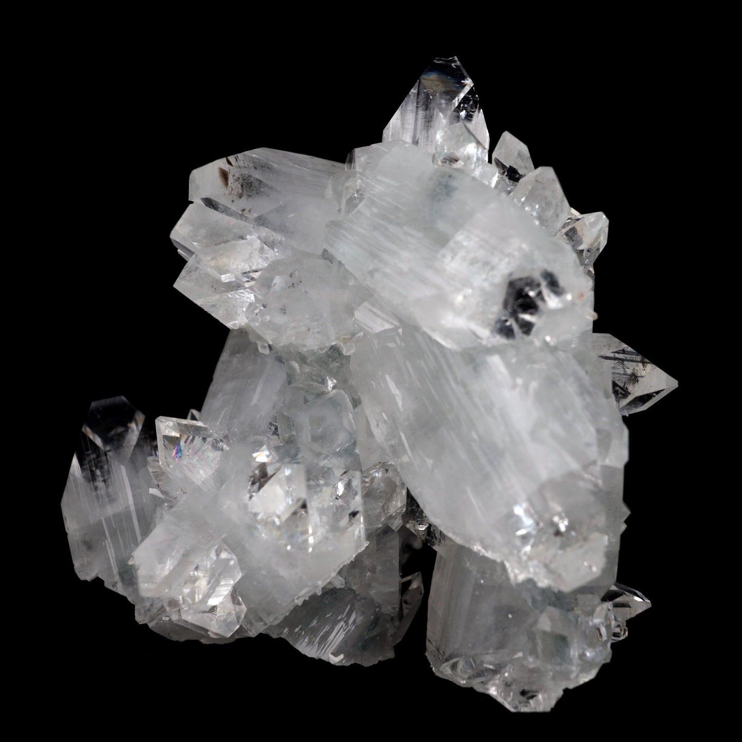 Apophyllite Terminated Sparkling Crystal Natural Mineral Specimen # B …  https://www.superbminerals.us/products/apophyllite-terminated-sparkling-crystal-natural-mineral-specimen-b-3928  FeaturesThis is a beautifully balanced and aesthetic specimen of water clear, transparent Apophyllite. Positioned perfectly in the center of a mass of lustrous Apophyllite crystals, is a large, perfect pyramidal Apophyllite crystal. This piece really stands out, is a great show piece, and has no damage