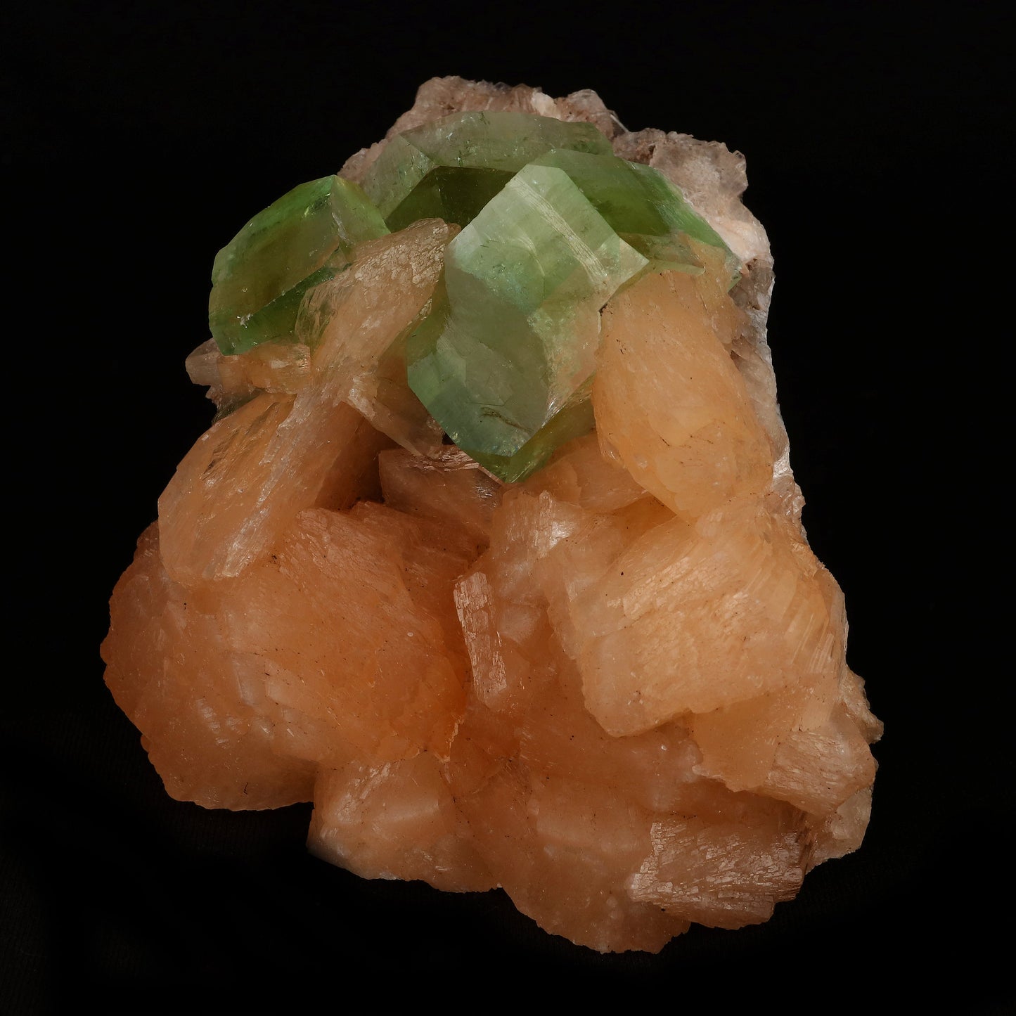 Bi-colored Fluorapophyllite and Stilbite Natural Mineral Specimen # B…  https://www.superbminerals.us/products/green-apophyllite-cubic-crystal-with-stilbite-natural-mineral-specimen-b-5077  Features: A striking, large blocky, color-zoned apophyllite crystal aesthetically flanked by similar smaller crystals dramatically highlights this impressive large mounded combination from recent finds in Jalgaon. The glassy, translucent tetragonal apophyllites have rich mint-green centers and colorless terminations 