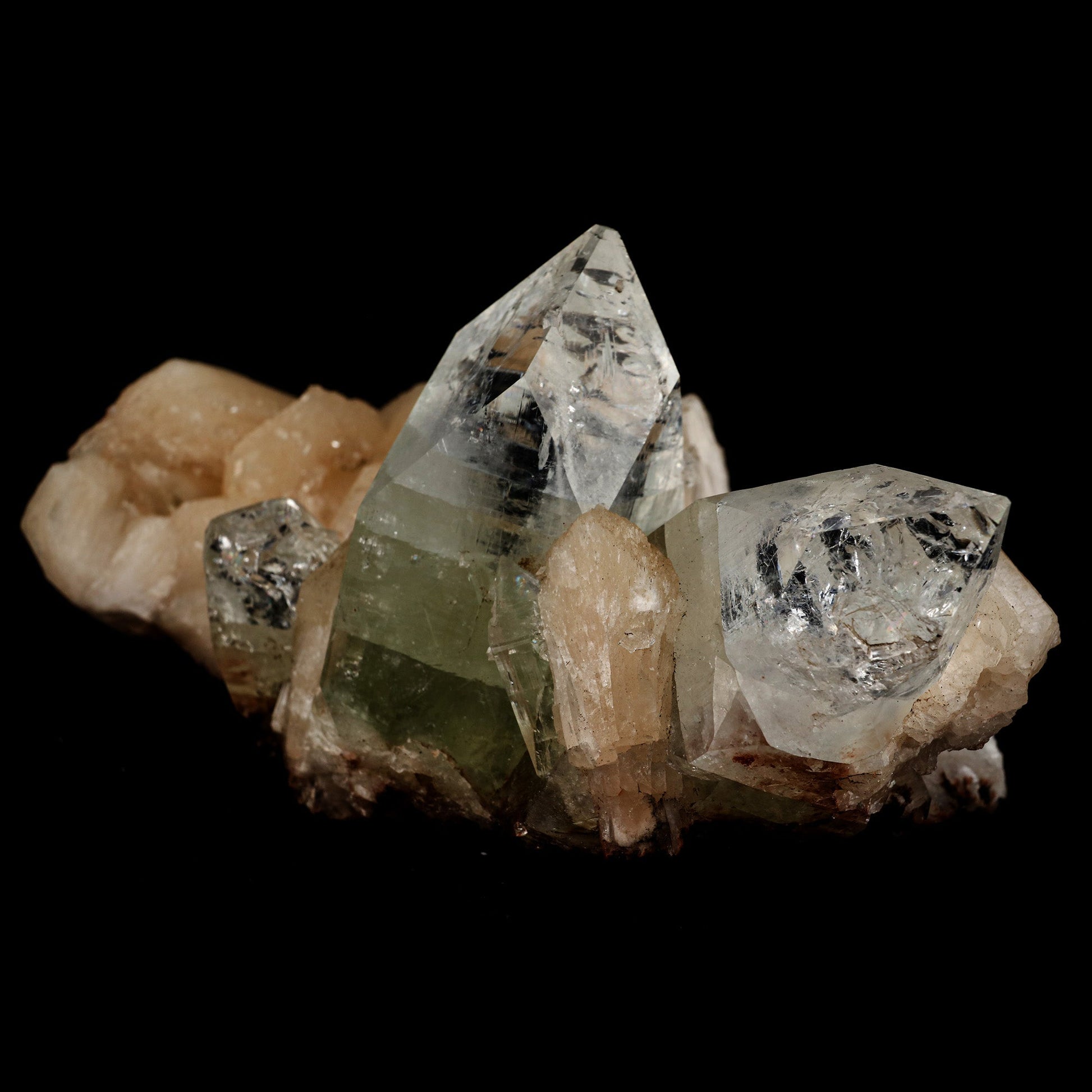 Bi- Colored Green Apophyllite with Stilbite Natural Mineral Specimen …  https://www.superbminerals.us/products/bi-colored-green-apophyllite-with-stilbite-natural-mineral-specimen-b-5102  Features: Rich green, extremely glassy, transparent apophyllite crystals from Jalgaon are arranged in a charming and aesthetically pleasing thumbnail spray. The spray is cleverly connected to iridescent stilbite blades, which add to the overall effect. The apophyllites are almost completely free of contamination.