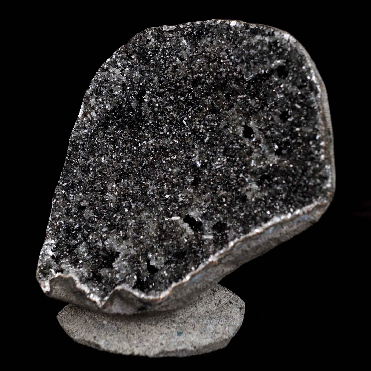 Black Sprakling Chalcedony Geode Natural Mineral Specimen # B 4629  https://www.superbminerals.us/products/black-sprakling-chalcedony-geode-natural-mineral-specimen-b-4629  Features: A massive Geode piece set with black stalactitic Chalcedony, partially covered with a glittering dreary Chalcedony druse, and facilitating a totally concentrated, deeply clear harmony hued Stilbite tie precious stone. There is another, more modest Stilbite precious stone at a corner, but it is the spotless