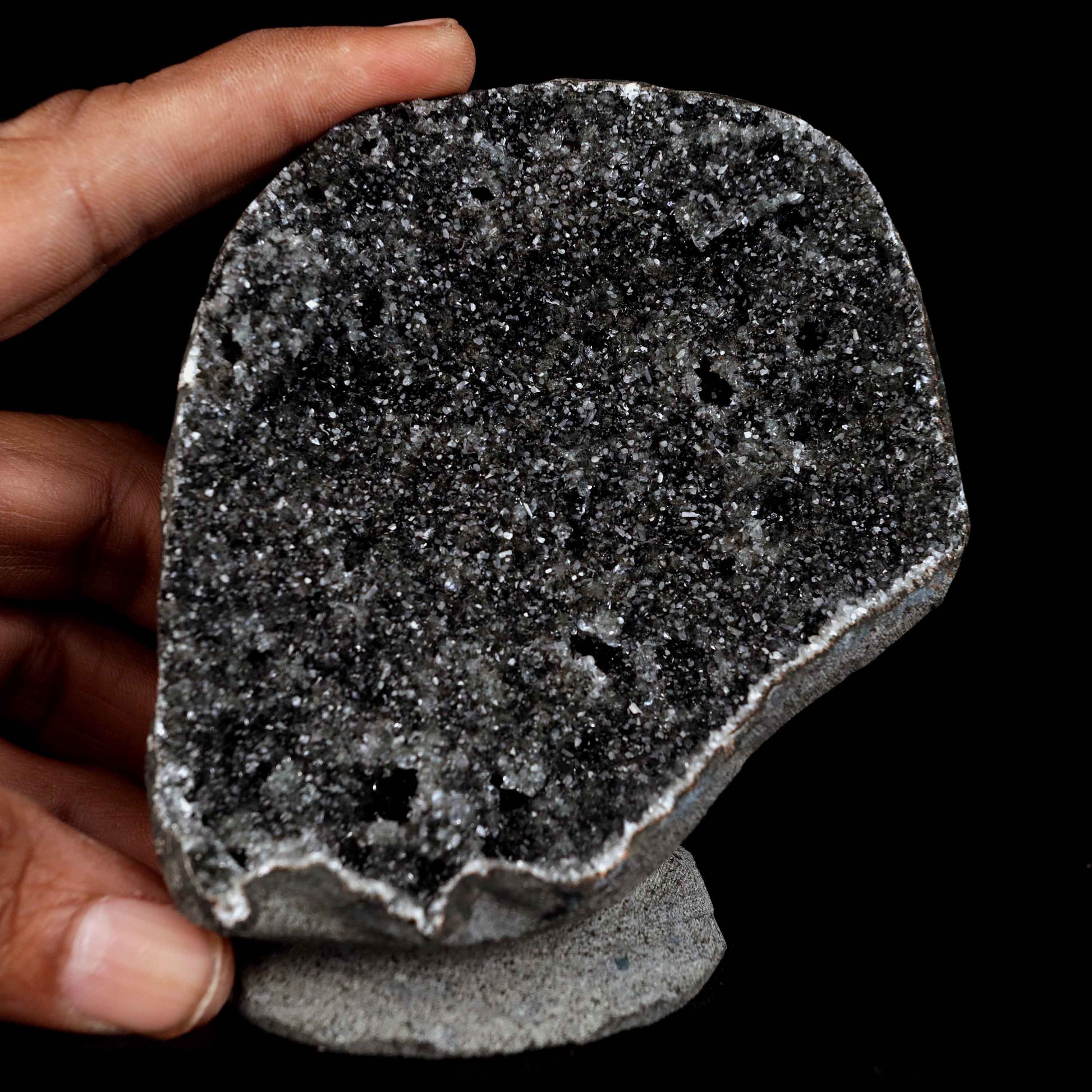 Black Sprakling Chalcedony Geode Natural Mineral Specimen # B 4629  https://www.superbminerals.us/products/black-sprakling-chalcedony-geode-natural-mineral-specimen-b-4629  Features: A massive Geode piece set with black stalactitic Chalcedony, partially covered with a glittering dreary Chalcedony druse, and facilitating a totally concentrated, deeply clear harmony hued Stilbite tie precious stone. There is another, more modest Stilbite precious stone at a corner, but it is the spotless