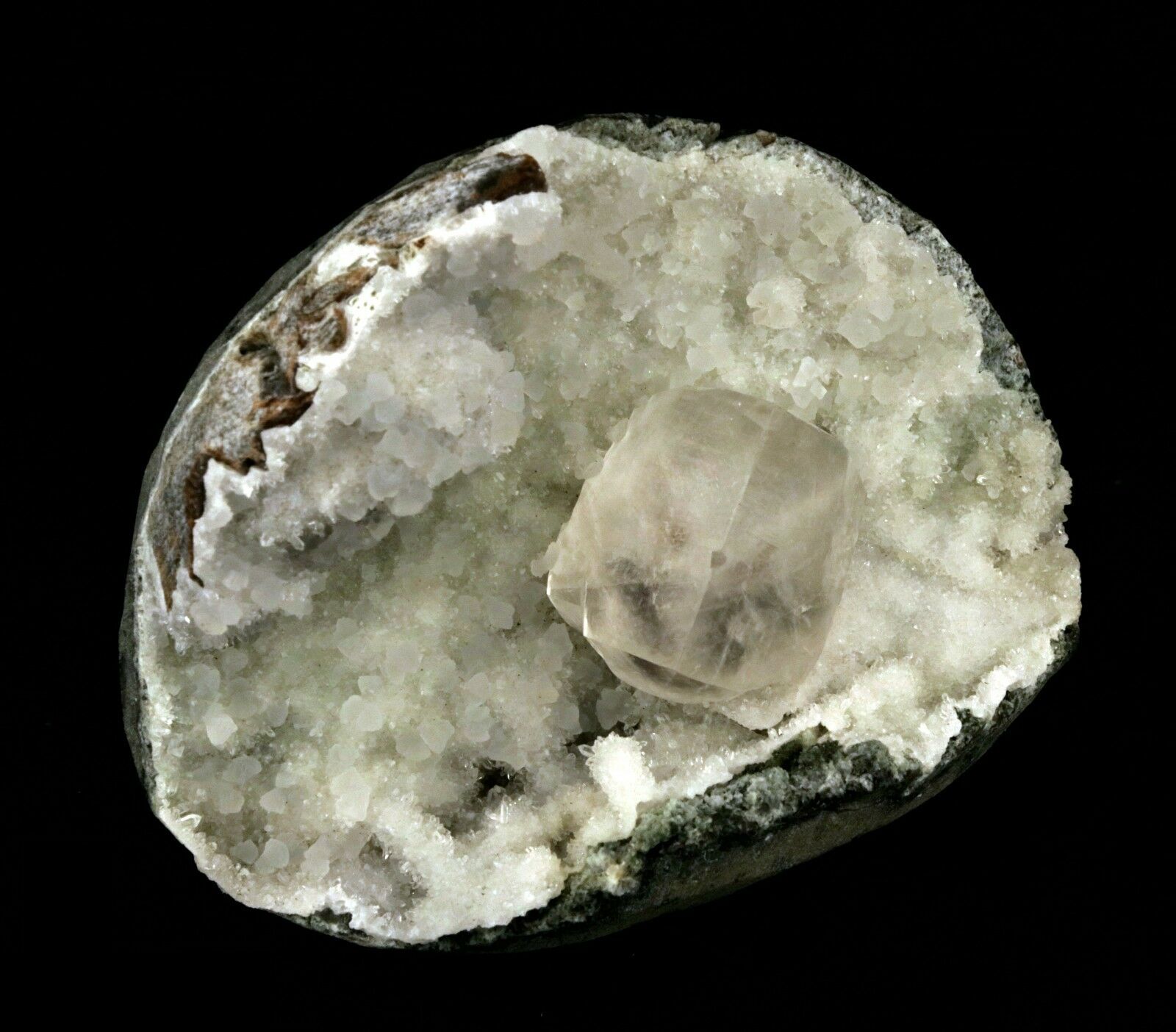 Calcite Cube inside MM Quartz Geode Natural Minerals Specimen # B 2490  https://www.superbminerals.us/products/calcite-cube-inside-mm-quartz-geode-natural-minerals-specimen-b-2490  Features: This is a superb piece that features an exceptionally large Geode lined with lustrous, colorless microcrystalline MM Quartz and MM Quartz hosting one large, translucent Calcite cube. The cube is flawless the result of being protected within a Geode and are perfectly positioned to give the piece outstanding