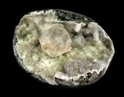 Calcite Cube inside MM Quartz Geode Natural Minerals Specimen # B 2490  https://www.superbminerals.us/products/calcite-cube-inside-mm-quartz-geode-natural-minerals-specimen-b-2490  Features: This is a superb piece that features an exceptionally large Geode lined with lustrous, colorless microcrystalline MM Quartz and MM Quartz hosting one large, translucent Calcite cube. The cube is flawless the result of being protected within a Geode and are perfectly positioned to give the piece outstanding