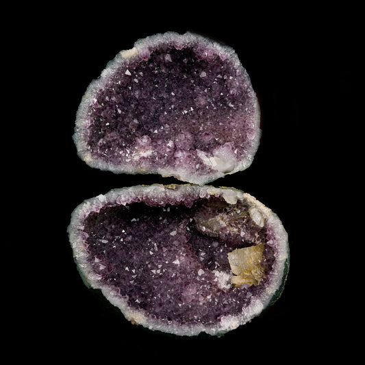 Calcite Inside Sparkling Amethyst Geode Natural Mineral Specimen # B …  https://www.superbminerals.us/products/calcite-inside-sparkling-amethyst-geode-natural-mineral-specimen-b-5217  Features: This piece demonstrates that you should never judge a book by its cover. It's basic and unattractive when you view these two halves combined. Even unattractive. It's a stunning contrast to watch it split apart and see the shiny, purple Amethyst crystals lining the entire cavity on both halves!