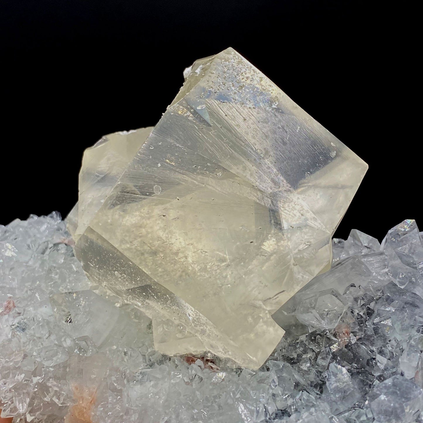 Calcite with Apophyllite on Heuladnite # Q9  https://www.superbminerals.us/products/calcite-with-apophyllite-on-heuladnite-q9  Features:Fascinating specimen of Calcite and impressive mirror lustrous gemmy Apophyllite crystals from superb find in Jalgaon. It displays twin honey colored Calcite Cube, well formed superb flat faces with excellent brilliance and light reflection.&nbsp; Lustrous Calcite crystals grow at the top forming aesthetic