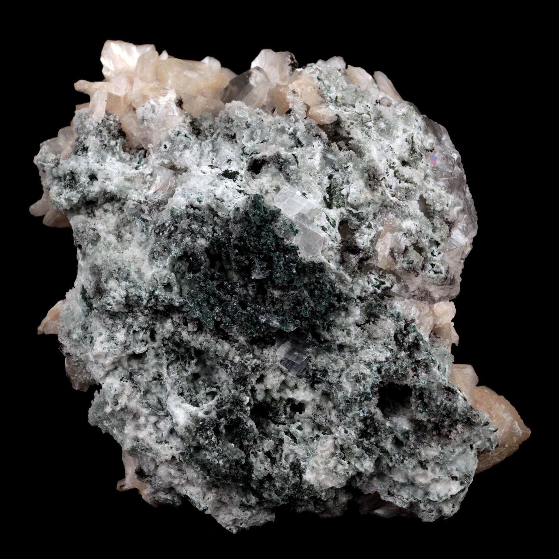 Calcite with Stilbite Natural Mineral Specimen (Repaired) # B 3904  https://www.superbminerals.us/products/calcite-with-stilbite-natural-mineral-specimen-repaired-b-3904  FeaturesA huge, delightful smooth white to smoky rhombohedral Calcite crystal, anxious, with crossing Stilbite crystals on a network of snow-white microcrystalline Quartz, with minor Apophyllite. 