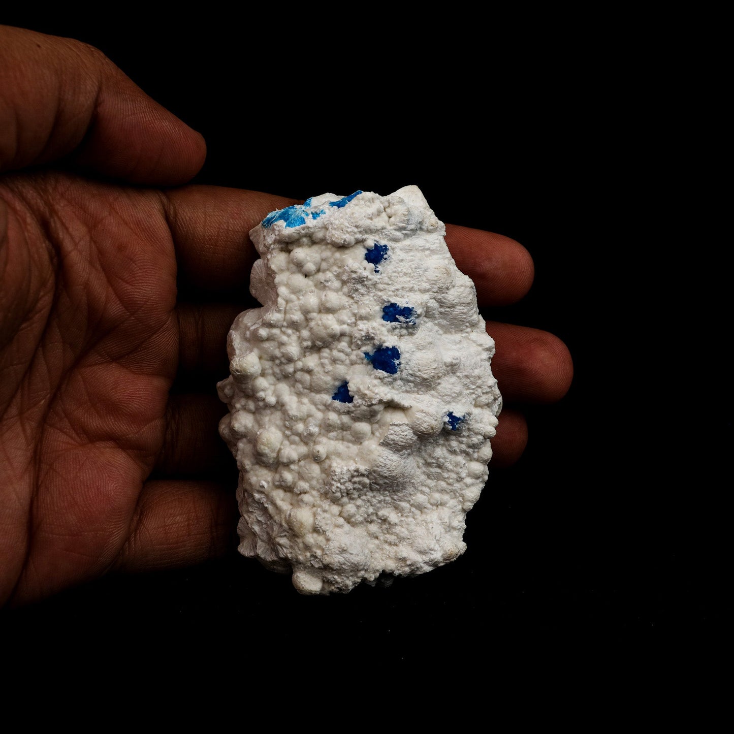 Cavansite on Mordenite Rare Find Natural Mineral Specimen # B 5141  https://www.superbminerals.us/products/cavansite-on-mordenite-rare-find-natural-mineral-specimen-b-5141  Features: Unusual combination of a large spherical rosette diameter of blue-green cavansite crystals on white mordenite-coated matrix . Primary Mineral(s): Cavansite Secondary Mineral(s): MordeniteMatrix: N/A 3 Inch x 2 InchWeight : 76 GmsLocality: Pune, Maharashtra, India Year of Discovery: 2021