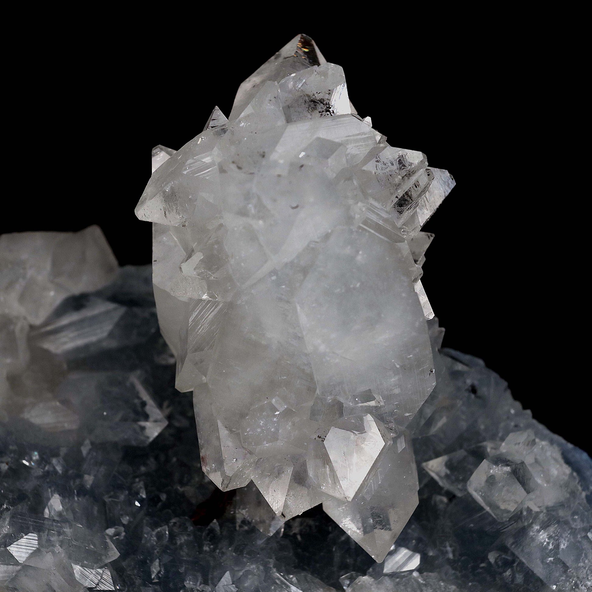 Clear Apophyllite Pointed Crystal on Heulandite Natural Mineral Specim…  https://www.superbminerals.us/products/clear-apophyllite-pointed-crystal-on-heulandite-natural-mineral-specimen-b-4658  Features: A classic group of very sharp, glassy, GEM / gemmy, colorless, tetragonal prisms of Apophyllite which are growing on a dark blue-grey colored stalactite of Heulandite and associated with a "pointed"-shaped crystal group of heulandite aesthetically flaring out of the lower portion of the piece.