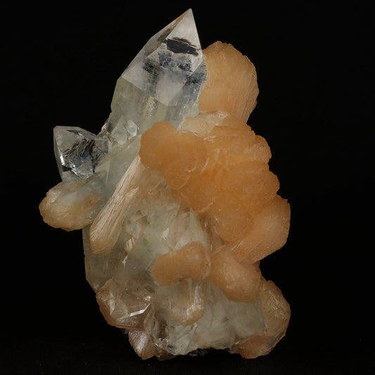 Clear Apophyllite With Stilbite Natural Mineral Specimen # B 5079  https://www.superbminerals.us/products/clear-apophyllite-with-stilbite-natural-mineral-specimen-b-5079  Features: Highlighted by a highly lustrous and partially gemmy, colorless fluorapophyllite crystal, this specimen also exhibits lustrous and translucent, pink stilbite crystals, to 2.8 cm in length. This specimen is a superb, sparkling combo piece! It is complete alla round and looks like a sparkling tower. 