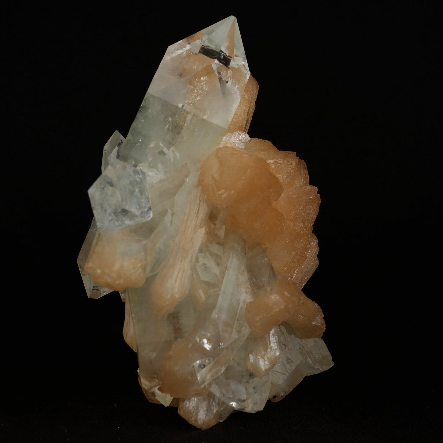Clear Apophyllite With Stilbite Natural Mineral Specimen # B 5079  https://www.superbminerals.us/products/clear-apophyllite-with-stilbite-natural-mineral-specimen-b-5079  Features: Highlighted by a highly lustrous and partially gemmy, colorless fluorapophyllite crystal, this specimen also exhibits lustrous and translucent, pink stilbite crystals, to 2.8 cm in length. This specimen is a superb, sparkling combo piece! It is complete alla round and looks like a sparkling tower. 