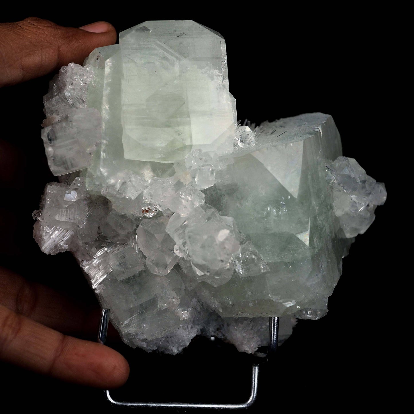 Fluorapophyllite Twin big Crystal with Stilbite Natural Mineral Specim…  https://www.superbminerals.us/products/fluorapophyllite-twin-big-crystal-natural-mineral-specimen-b-4641  Features: A typical Deccan Trap association specimen with strong, extremely glossy, crisp, well-formed, blocky, green and colourless Fluorapophyllite crystals (K).which are linked with extremely glossy, delicate peach coloured Stilbite-Ca "sheaves" A Chalcedony "core" may be seen in a tiny region on the back.
