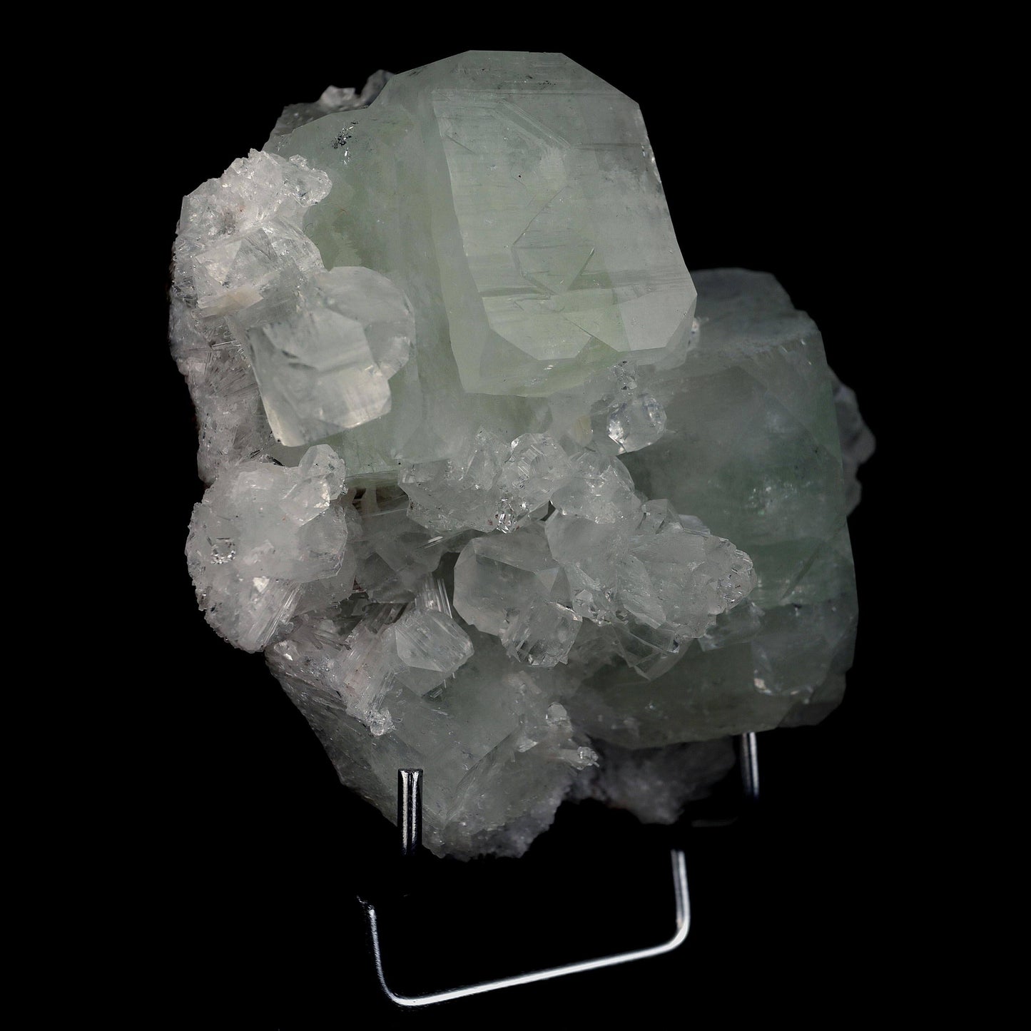 Fluorapophyllite Twin big Crystal with Stilbite Natural Mineral Specim…  https://www.superbminerals.us/products/fluorapophyllite-twin-big-crystal-natural-mineral-specimen-b-4641  Features: A typical Deccan Trap association specimen with strong, extremely glossy, crisp, well-formed, blocky, green and colourless Fluorapophyllite crystals (K).which are linked with extremely glossy, delicate peach coloured Stilbite-Ca "sheaves" A Chalcedony "core" may be seen in a tiny region on the back.