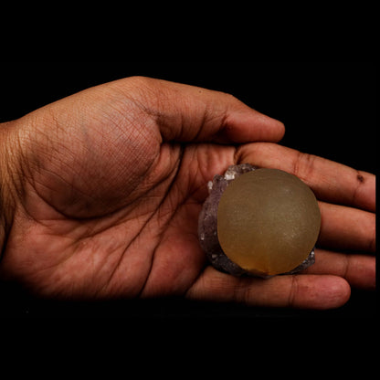 Fluorite Botridoal on Amethyst Natural Mineral Specimen # B 5194  https://www.superbminerals.us/products/fluorite-botridoal-on-amethyst-natural-mineral-specimen-b-5194  Features: An extremely botryoidal "ball" of Fluorite perches above an incredibly rich purple-colored Amethyst on Chalcedony and host rock matrix, resulting in an unusually stunning specimen. The Fluorite is a creamy-white tone on the surface that gradually fades away to a golden tint in the centre.