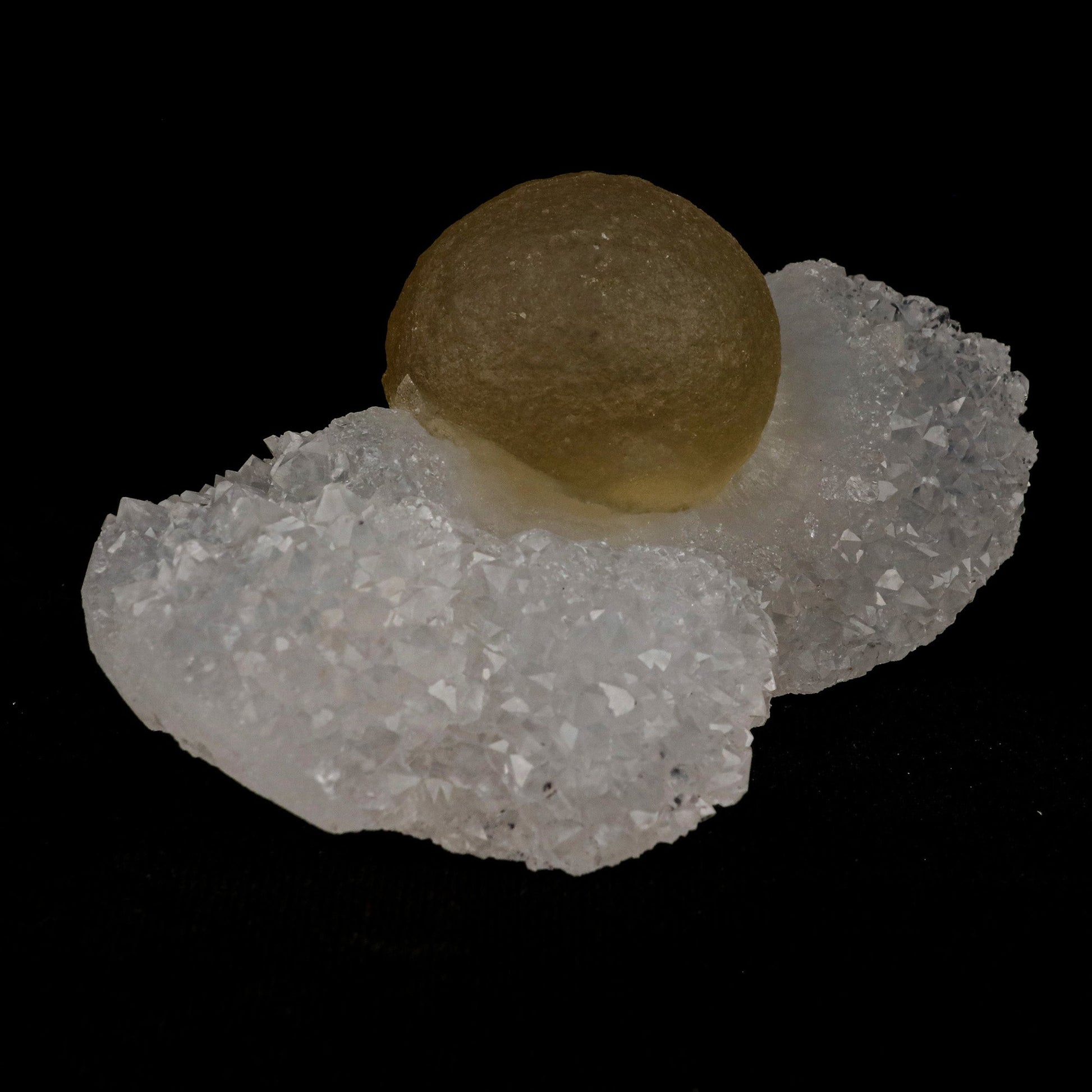 Fluorite Botridoal on MM Quartz Natural Mineral Specimen # B 5131  https://www.superbminerals.us/products/fluorite-botridoal-on-mm-quartz-natural-mineral-specimen-b-5131  Features: These golden botryoidal fluorites are unique and extremely attractive. This specimen features a a very gemmy, good sized, rich golden color, fluorite "sphere" on gemmy, colorless, stubby quartz crystal matrix. Primary Mineral(s): Fluorite