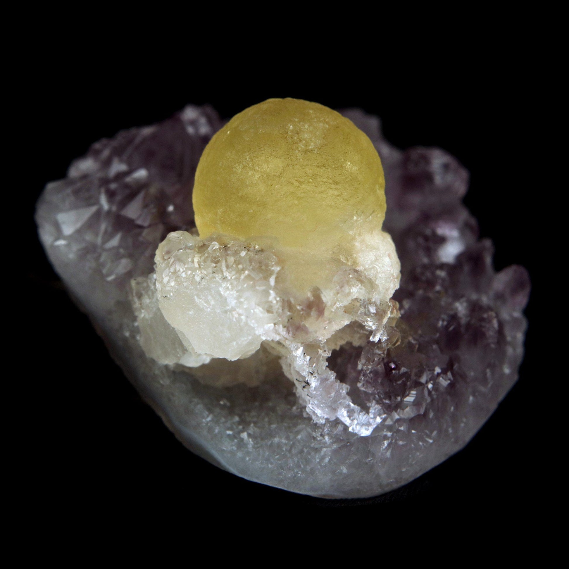 Fluorite Botryoidal on Amethyst Natural Mineral Specimen # B 4888  https://www.superbminerals.us/products/fluorite-botryoidal-on-amethyst-natural-mineral-specimen-b-4888  Features: An extraordinarily botryoidal "ball" of Fluorite is perched atop an exceptionally rich purple coloured Amethyst on Chalcedony and host rock matrix, creating an unusually beautiful specimen