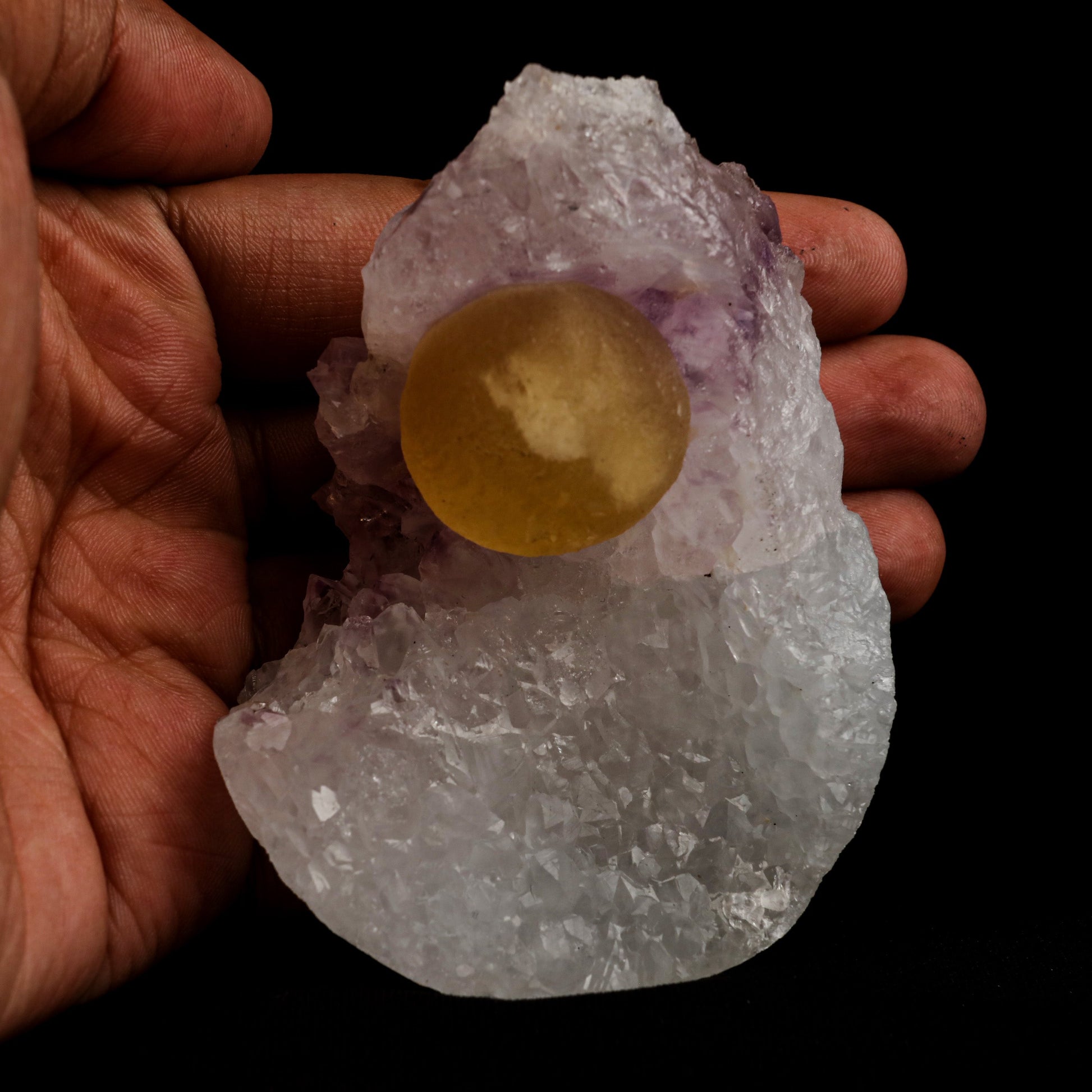 Fluorite Botryoidal on Amethyst Natural Mineral Specimen # B 5058  https://www.superbminerals.us/products/fluorite-botryoidal-on-amethyst-natural-mineral-specimen-b-5058  Features: An extraordinarily botryoidal "ball" of Fluorite is perched atop an exceptionally rich purple coloured Amethyst on Chalcedony and host rock matrix, creating an unusually beautiful specimen.&nbsp; On the surface, the Fluorite is a creamy-white tone that gradually fades away to a golden hue in the middle.