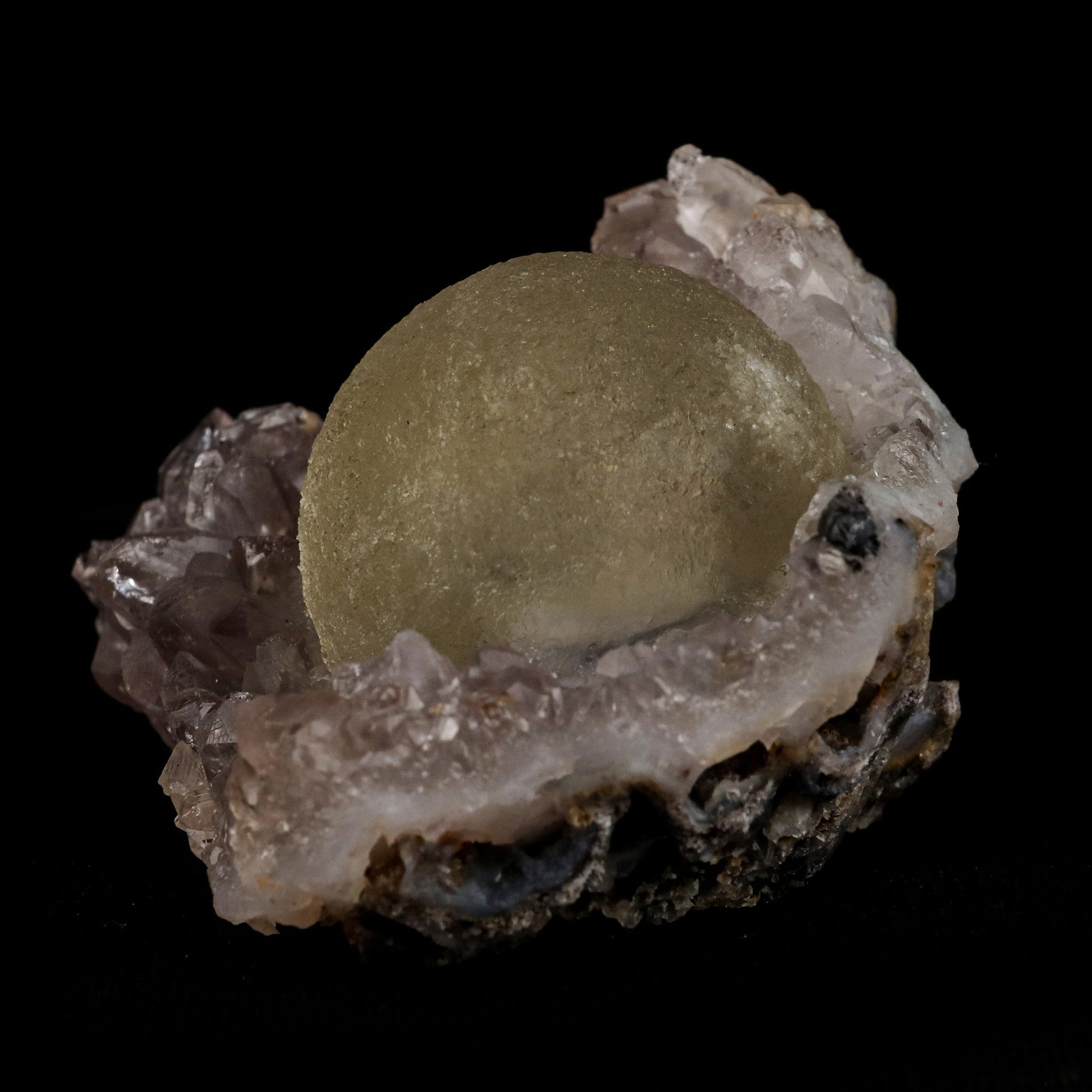 Fluorite Botryoidal on Amethyst Natural Mineral Specimen # B 5107  https://www.superbminerals.us/products/fluorite-botryoidal-on-amethyst-natural-mineral-specimen-b-5107  Features: An extraordinarily botryoidal "ball" of Fluorite is perched atop an exceptionally rich purple coloured Amethyst on Chalcedony and host rock matrix, creating an unusually beautiful specimen.&nbsp; On the surface, the Fluorite is a creamy-white tone that gradually fades away to a golden hue in the middle