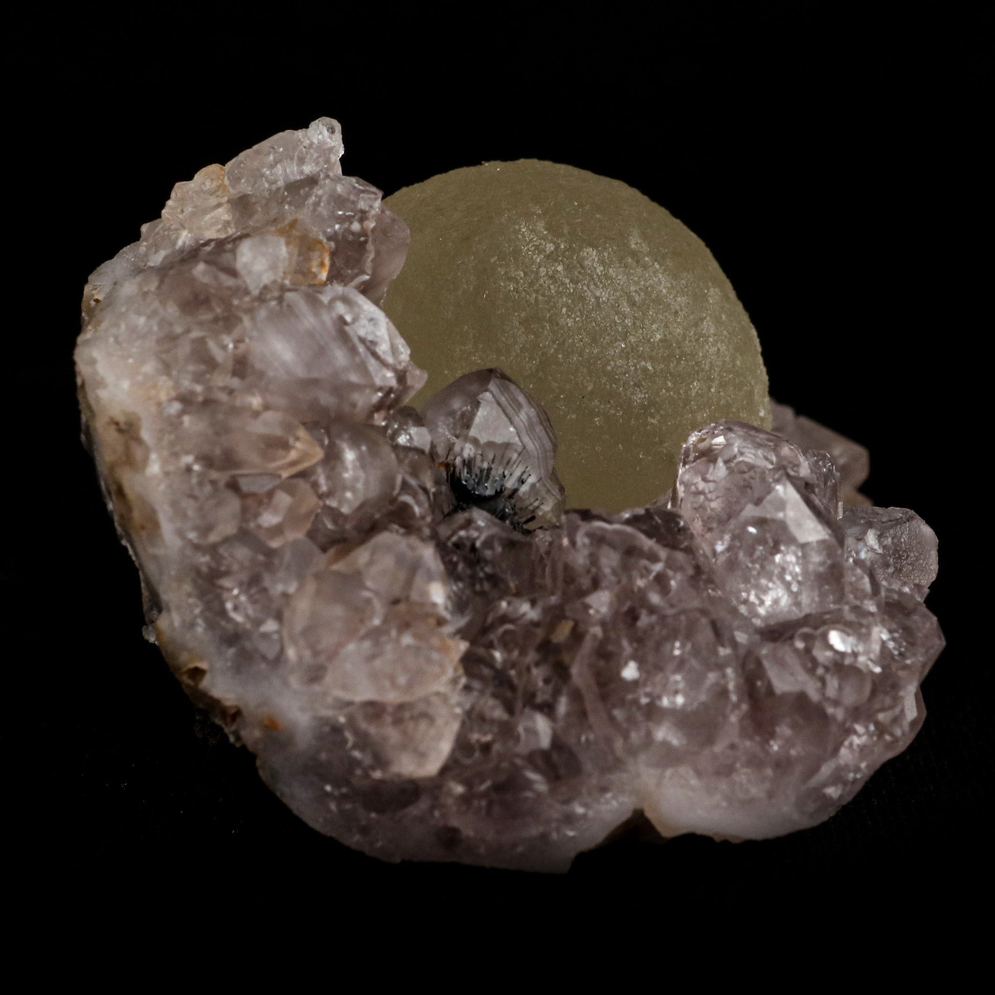 Fluorite Botryoidal on Amethyst Natural Mineral Specimen # B 5107  https://www.superbminerals.us/products/fluorite-botryoidal-on-amethyst-natural-mineral-specimen-b-5107  Features: An extraordinarily botryoidal "ball" of Fluorite is perched atop an exceptionally rich purple coloured Amethyst on Chalcedony and host rock matrix, creating an unusually beautiful specimen.&nbsp; On the surface, the Fluorite is a creamy-white tone that gradually fades away to a golden hue in the middle