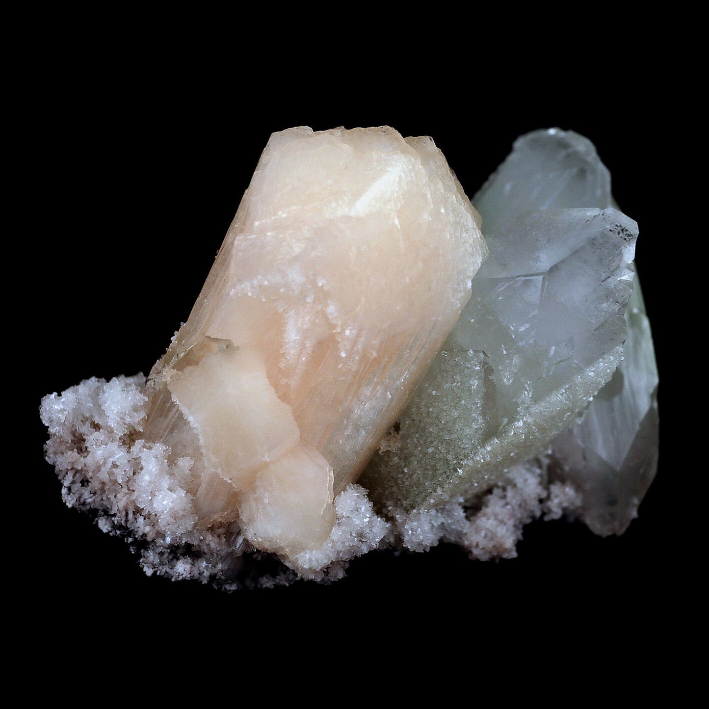 Fluro Apophyllite With Stilbite on Chalcedony Natural Mineral Specimen…  https://www.superbminerals.us/products/fluro-apophyllite-with-stilbite-on-chalcedony-natural-mineral-specimen-b-4428  Features: Jalgaon's elegant cluster of classic two-toned apophyllite crystals. The sharply tetragonal, very glassy crystals have striking water-clear, gem, colourless steeply pyramidal terminations and subtle pastel-green bodies. The large doubly terminated crystal measures 7.8 cm in length