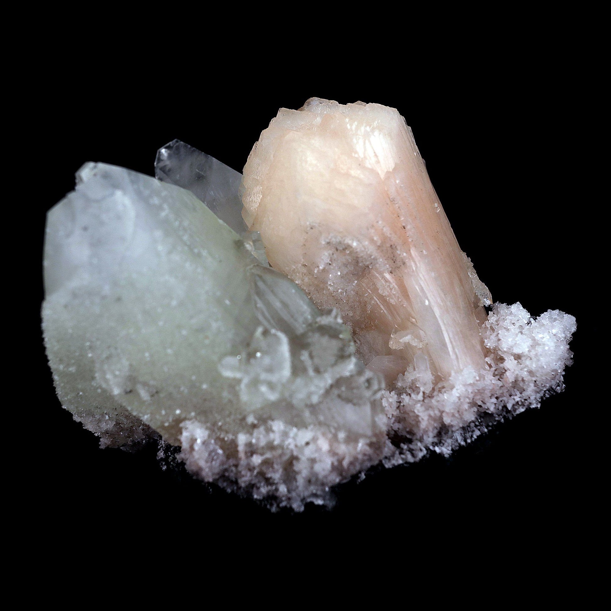 Fluro Apophyllite With Stilbite on Chalcedony Natural Mineral Specimen…  https://www.superbminerals.us/products/fluro-apophyllite-with-stilbite-on-chalcedony-natural-mineral-specimen-b-4428  Features: Jalgaon's elegant cluster of classic two-toned apophyllite crystals. The sharply tetragonal, very glassy crystals have striking water-clear, gem, colourless steeply pyramidal terminations and subtle pastel-green bodies. The large doubly terminated crystal measures 7.8 cm in length