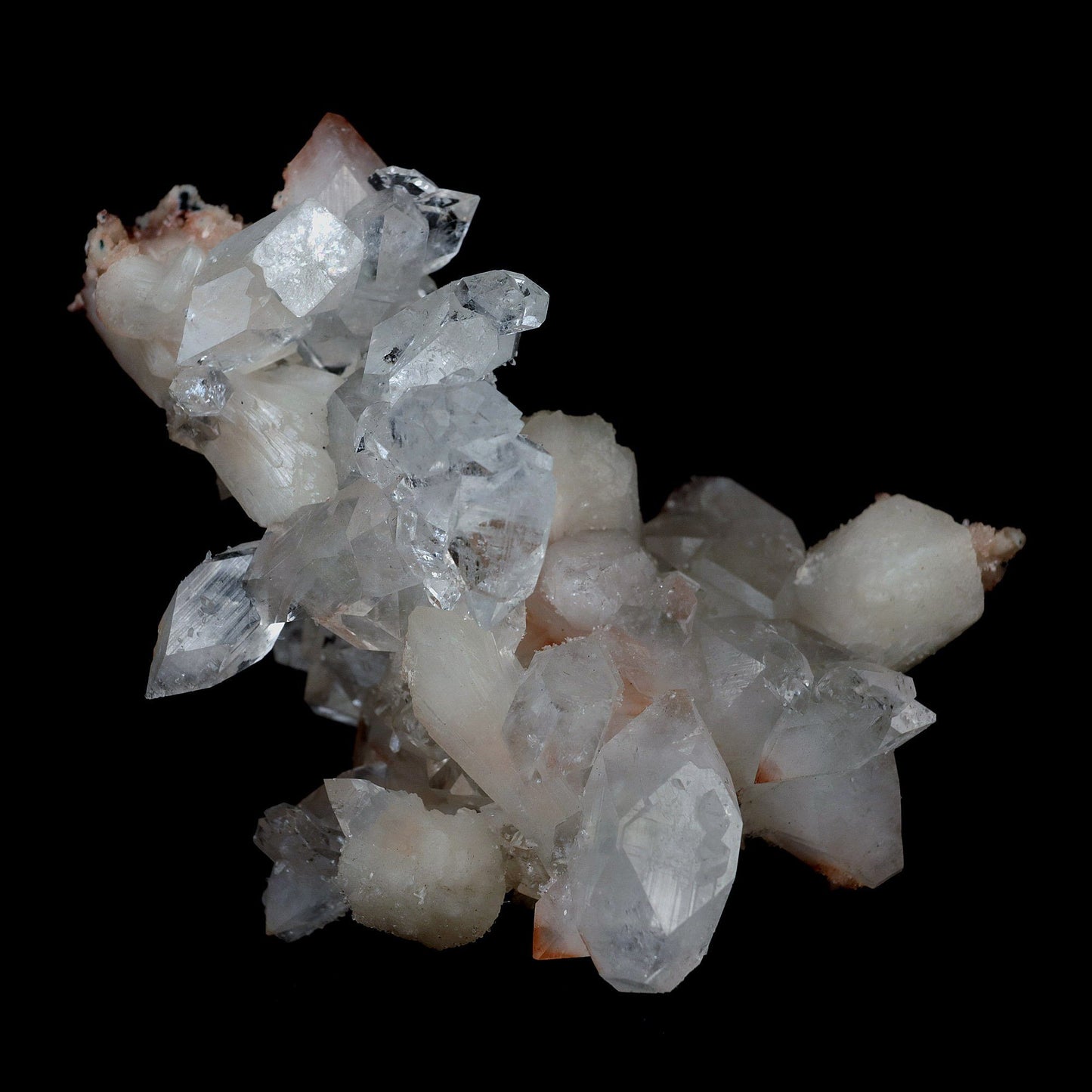 Gemmy Pointed Apophyllite with Stilbite Barbellate Formation # B 4167  https://www.superbminerals.us/products/gemmy-pointed-apophyllite-with-stilbite-barbellate-formation-b-4167  Features:Beautiful gem Apophyllite crystals decorated by Stilbite. It displays superb colorless up to bit reddish crystals. They have razor sharp octahedral shape. The crystals have glassy luster and pretty striations. The Apophyllite is from translucent to transparent and gemmy. Stilbite grow on the Apophyllite