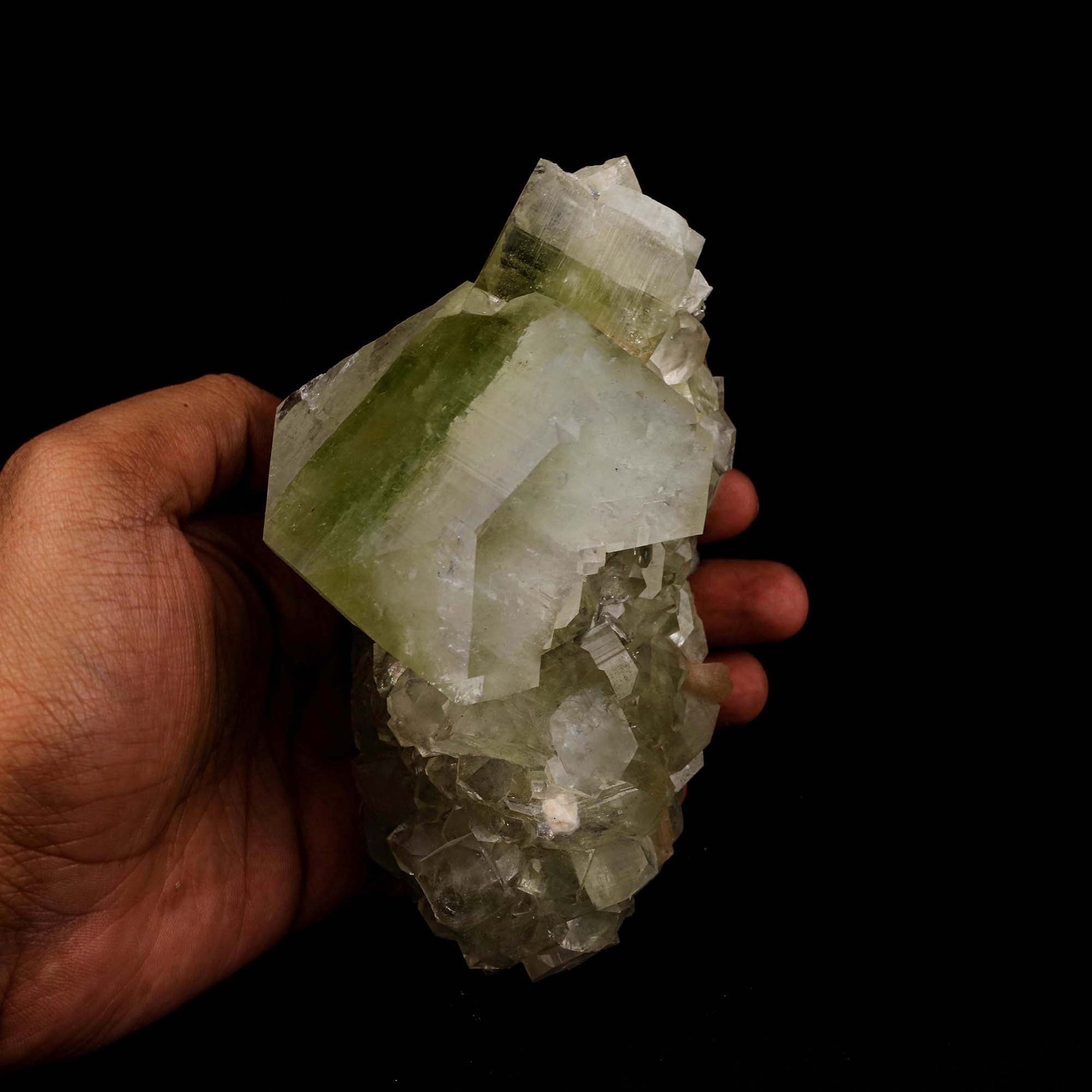 Green Apophyllite Cube Natural Mineral Specimen # B 5187  https://www.superbminerals.us/products/green-apophyllite-cube-natural-mineral-specimen-b-5187  Features: This outstanding huge mounded combination from Jalgaon's recent findings is highlighted by a magnificent color-zoned apophyllite crystal bordered by lesser crystals of the same type.The rich mint-green centres and colourless terminations on the glassy, translucent tetragonal apophyllites are offset