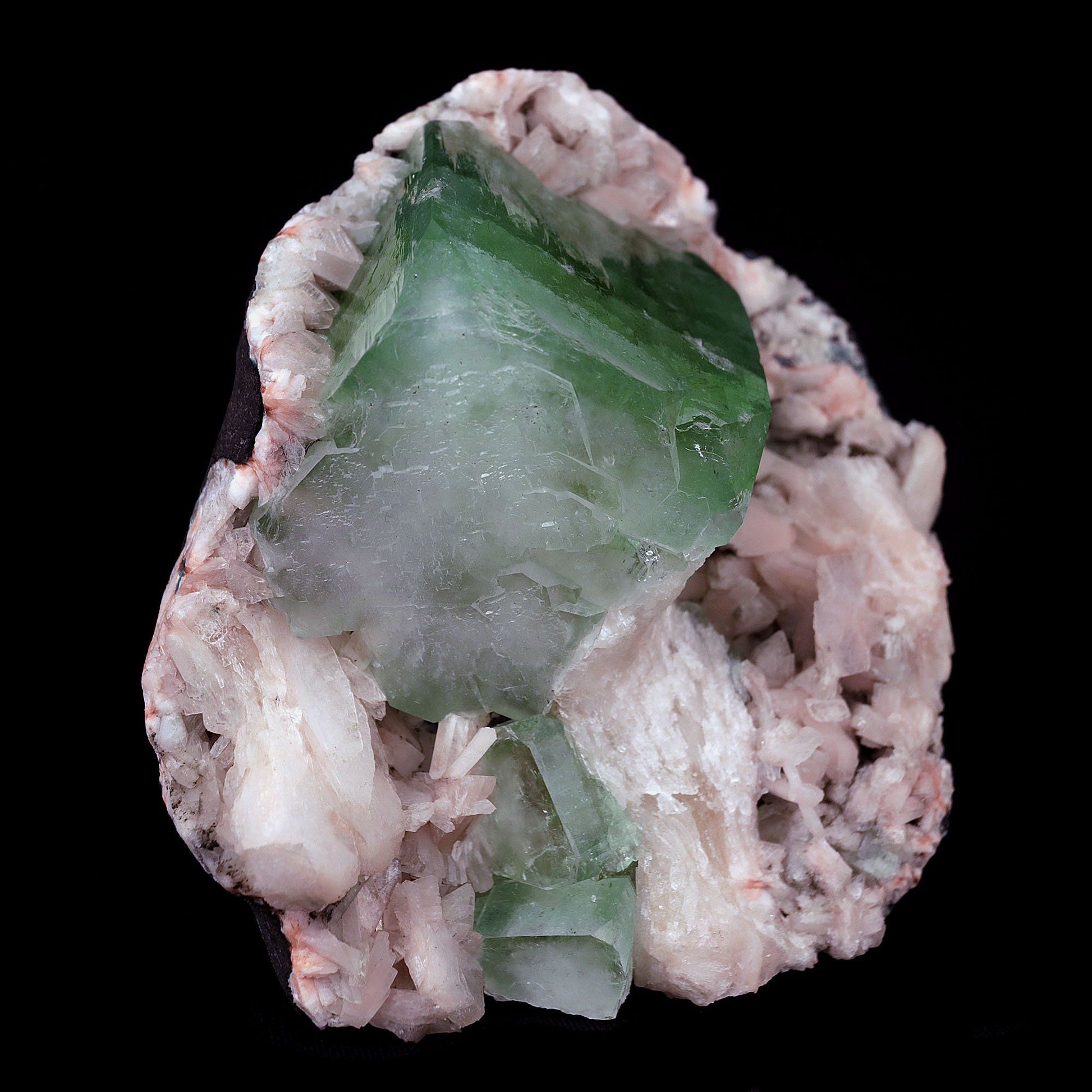 Green Apophyllite Cube with Stilbite Heulandite Natural Mineral # B 41…  https://www.superbminerals.us/products/green-apophyllite-cube-with-stilbite-heulandite-natural-mineral-b-4161  Features:Large shallow vug with a transparent penetrating layerd dark green to mint green Apophyllite cubic crystal on druzy chalcedony formations with Stilbite crystals, all on a bed of white miniature Huelandite crystals on a dark gray Matrix. The color of the Apophyllite is exceptional as is the contrast 