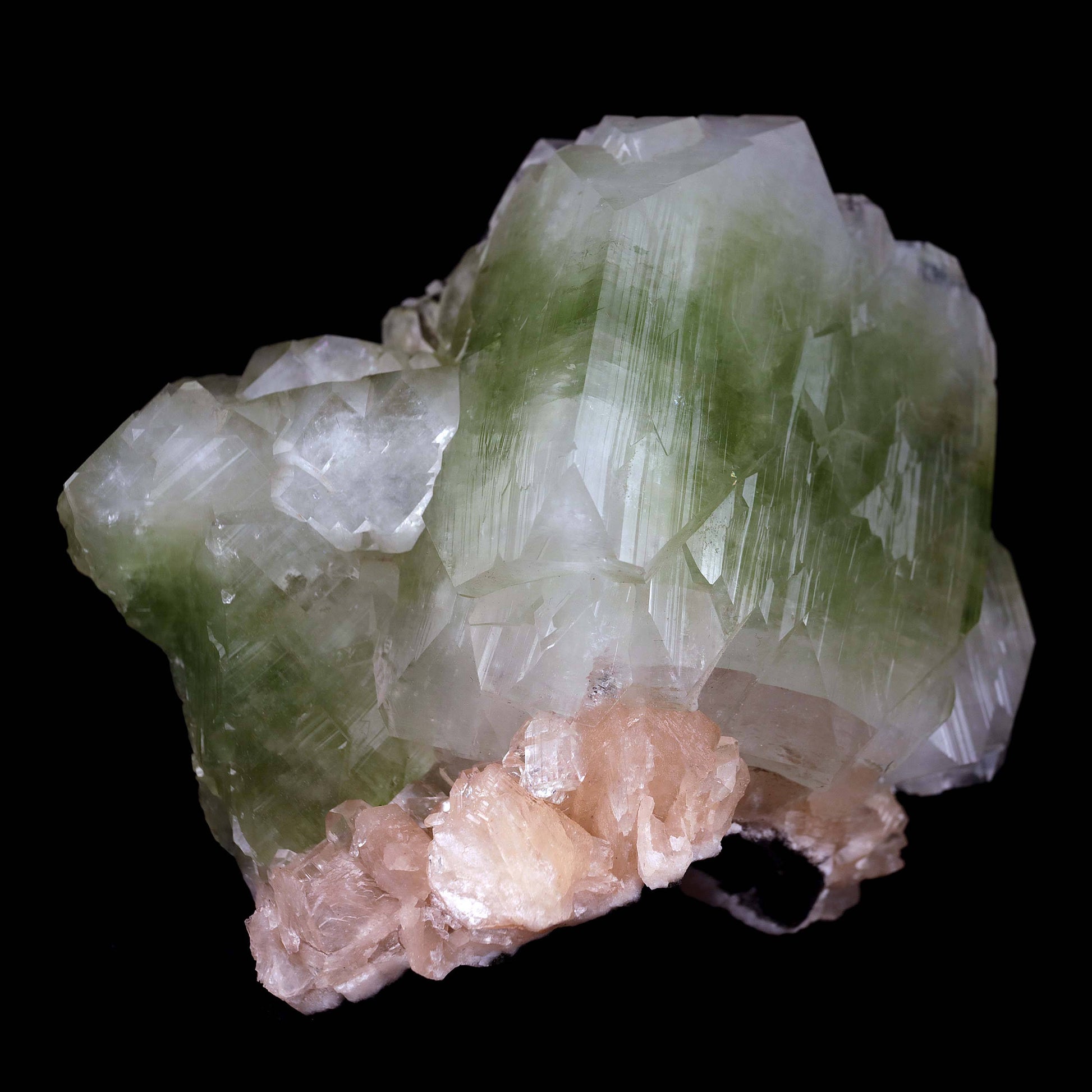 Green Apophyllite Cube with Stilbite Natural Mineral Specimen # B 448…  https://www.superbminerals.us/products/green-apophyllite-cube-with-stilbite-natural-mineral-specimen-b-4482  Features:This is a very fine, big, doubly terminated, glossy and translucent bicolored green fluorapophyllite crystal that has been tastefully set on a matrix of aged basalt and quartz druse. A few beautiful, ivory-colored stilbite crystals encircle the base. 