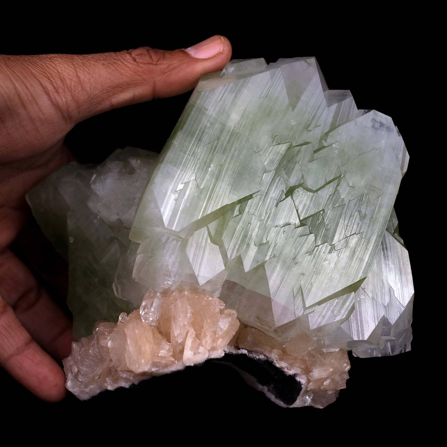 Green Apophyllite Cube with Stilbite Natural Mineral Specimen # B 448…  https://www.superbminerals.us/products/green-apophyllite-cube-with-stilbite-natural-mineral-specimen-b-4482  Features:This is a very fine, big, doubly terminated, glossy and translucent bicolored green fluorapophyllite crystal that has been tastefully set on a matrix of aged basalt and quartz druse. A few beautiful, ivory-colored stilbite crystals encircle the base. 