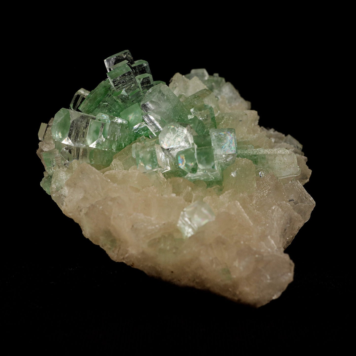 Green Apophyllite Disco Ball with Stilbite Natural Mineral Specimen #…  https://www.superbminerals.us/products/green-apophyllite-disco-ball-with-stilbite-natural-mineral-specimen-b-5120  Features: The finding of these spectacular fluorapophyllite "disco balls" while excavating huge diameter water wells is without a doubt one of the Deccan Traps' Great Finds.A "small ball" over... "ball" of densely intergrown, gemmy, highly glassy, mint-green to colourless tetragonal crystals with pinacoidal termination