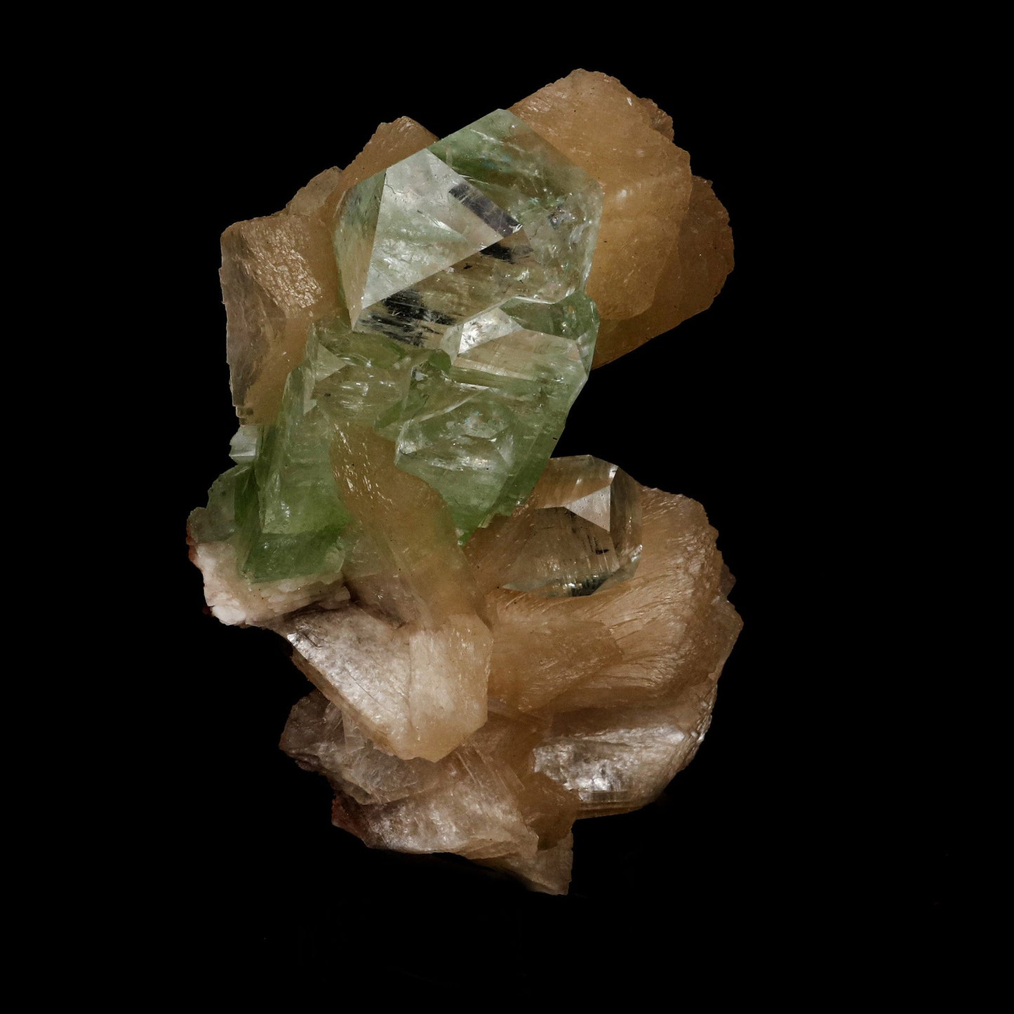 Green Apophyllite Pesudo Crystals with Stilbite Natural Mineral Specim…  https://www.superbminerals.us/products/copy-of-green-apophyllite-pesudo-crystals-with-stilbite-natural-mineral-specimen-b-5238  Features: In this large mounded combination from Nashik's recent discoveries, a stunning color-zoned apophyllite crystal is surrounded by smaller crystals of the same type. Tetragonal apophyllites have glassy, translucent centers and colourless terminations, which are offset by the modified corners 