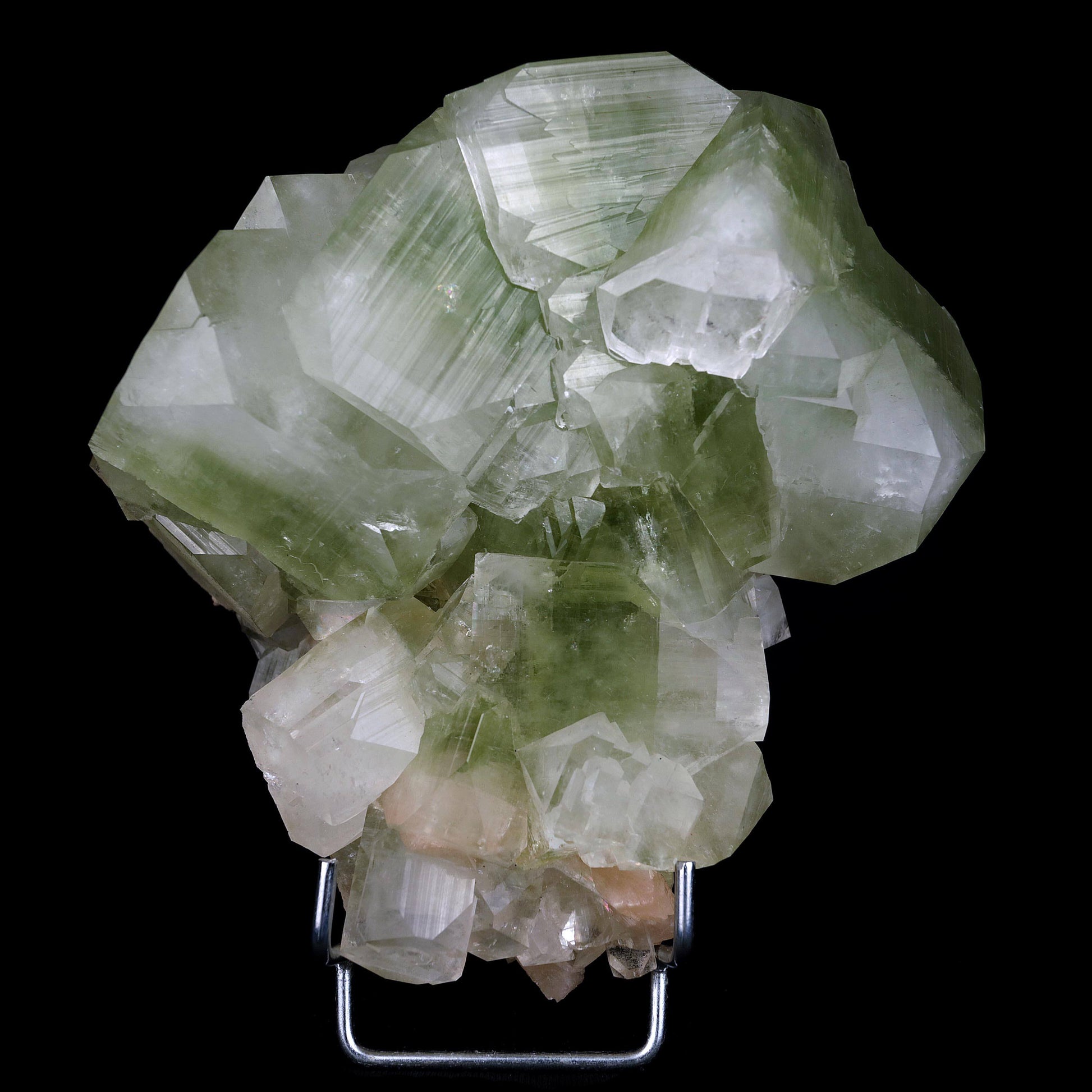 Green Apophyllite Terminate Cubes with Stilbite Natural Mineral Specim…  https://www.superbminerals.us/products/green-apophyllite-terminate-cubes-with-stilbite-natural-mineral-specimen-b-4485  Features:Fluorapophyllite crystals with soft peach coloured Stilbite crystals on minor matrix from Jalgaon of excellent grade, classic, sharp, extremely glossy, doubly terminated. A bright blazing green hue dominates the middle of the Apophyllite group, whereas the ends of the Apophyllite.