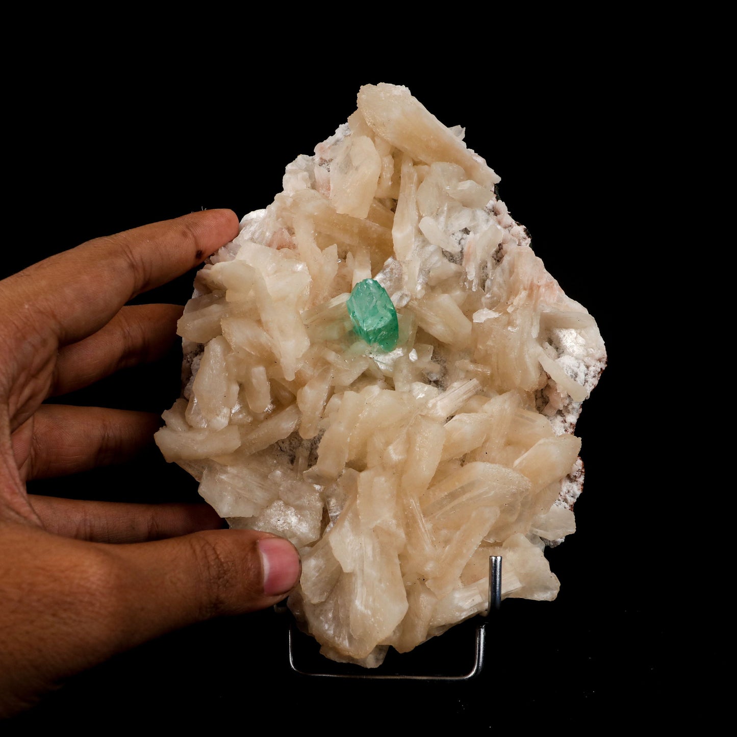 Green Apophyllite with Stilbite Natural Mineral Specimen # B 4995  https://www.superbminerals.us/products/green-apophyllite-with-stilbite-natural-mineral-specimen-b-4995  Features:&nbsp;Transparent green apophyllite crystals long with lustrous crystal faces and steep pyramidal terminations on matrix coated with lustrous peach-baggie coloured Stilbite crystals of varying sizes. Primary Mineral(s): ApophylliteSecondary Mineral(s): StilbiteMatrix: N/A 7 Inch x 5 InchWeight : 968 