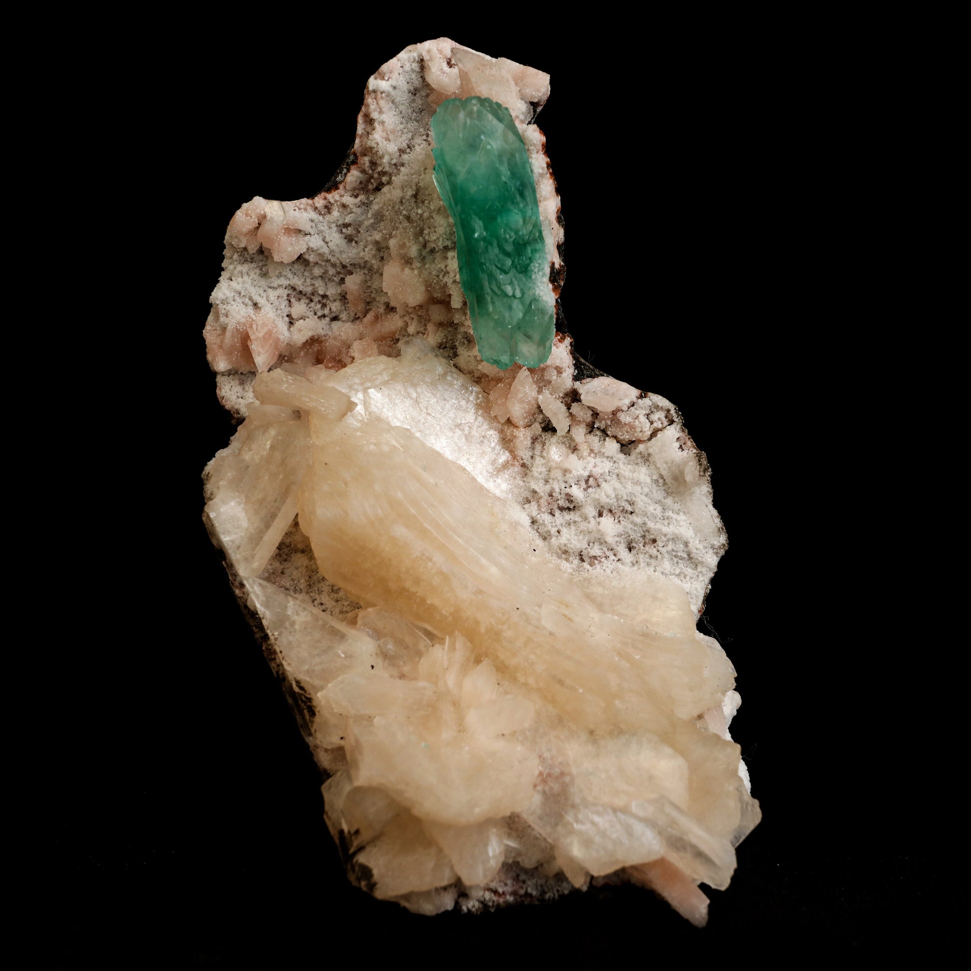 Green Apophyllite with Stilbite Natural Mineral Specimen # B 5045  https://www.superbminerals.us/products/green-apophyllite-with-stilbite-natural-mineral-specimen-b-5045  Features: Transparent green apophyllite crystals long with lustrous crystal faces and steep pyramidal terminations on matrix coated with lustrous peach-baggie coloured Stilbite crystals of varying sizes. Primary Mineral(s): Apophyllite
