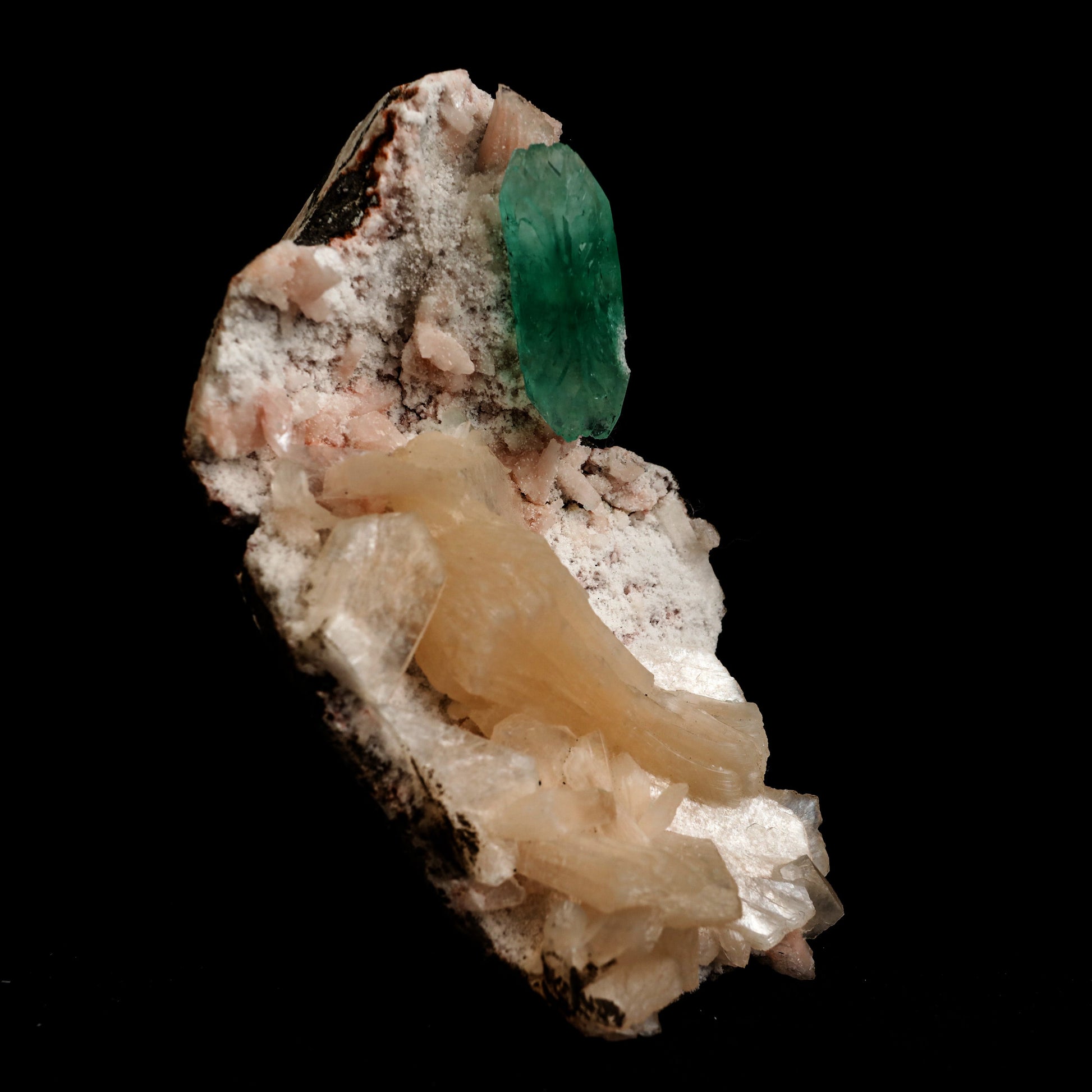 Green Apophyllite with Stilbite Natural Mineral Specimen # B 5045  https://www.superbminerals.us/products/green-apophyllite-with-stilbite-natural-mineral-specimen-b-5045  Features: Transparent green apophyllite crystals long with lustrous crystal faces and steep pyramidal terminations on matrix coated with lustrous peach-baggie coloured Stilbite crystals of varying sizes. Primary Mineral(s): Apophyllite