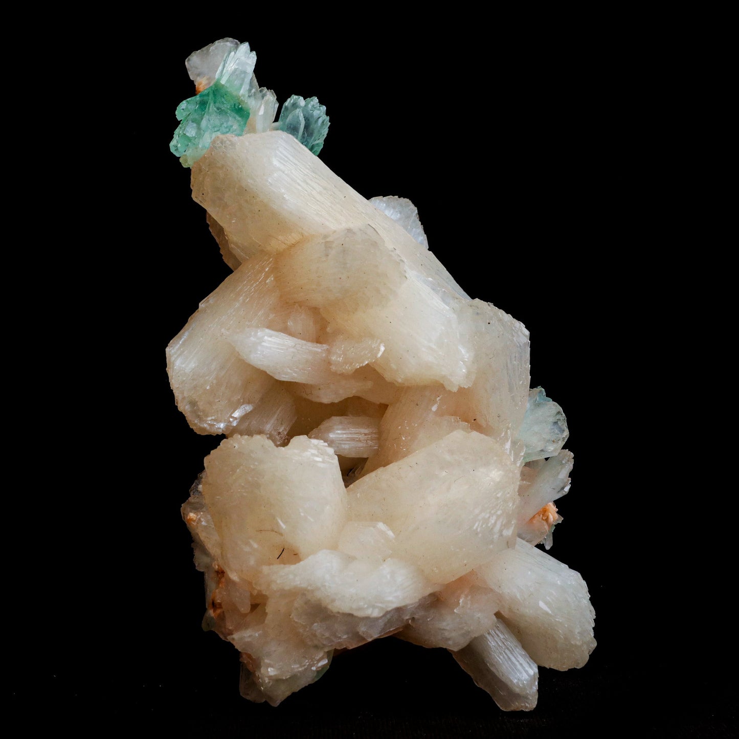 Green Apophyllite with Stilbite Natural Mineral Specimen # B 5056  https://www.superbminerals.us/products/green-apophyllite-with-stilbite-natural-mineral-specimen-b-5056  Features: Transparent green apophyllite crystals long with lustrous crystal faces and steep pyramidal terminations on matrix coated with lustrous peach-baggie coloured Stilbite crystals of 