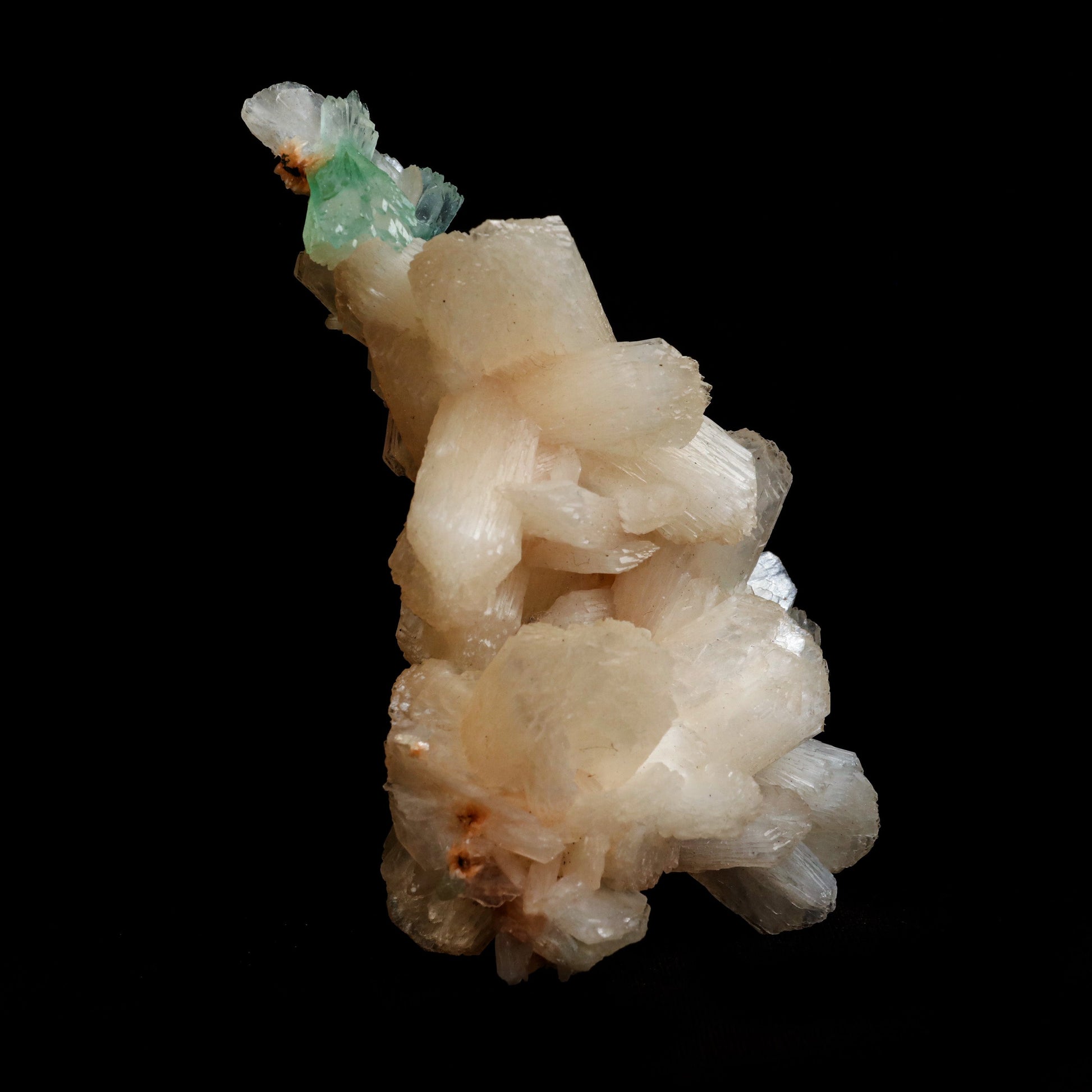 Green Apophyllite with Stilbite Natural Mineral Specimen # B 5056  https://www.superbminerals.us/products/green-apophyllite-with-stilbite-natural-mineral-specimen-b-5056  Features: Transparent green apophyllite crystals long with lustrous crystal faces and steep pyramidal terminations on matrix coated with lustrous peach-baggie coloured Stilbite crystals of 