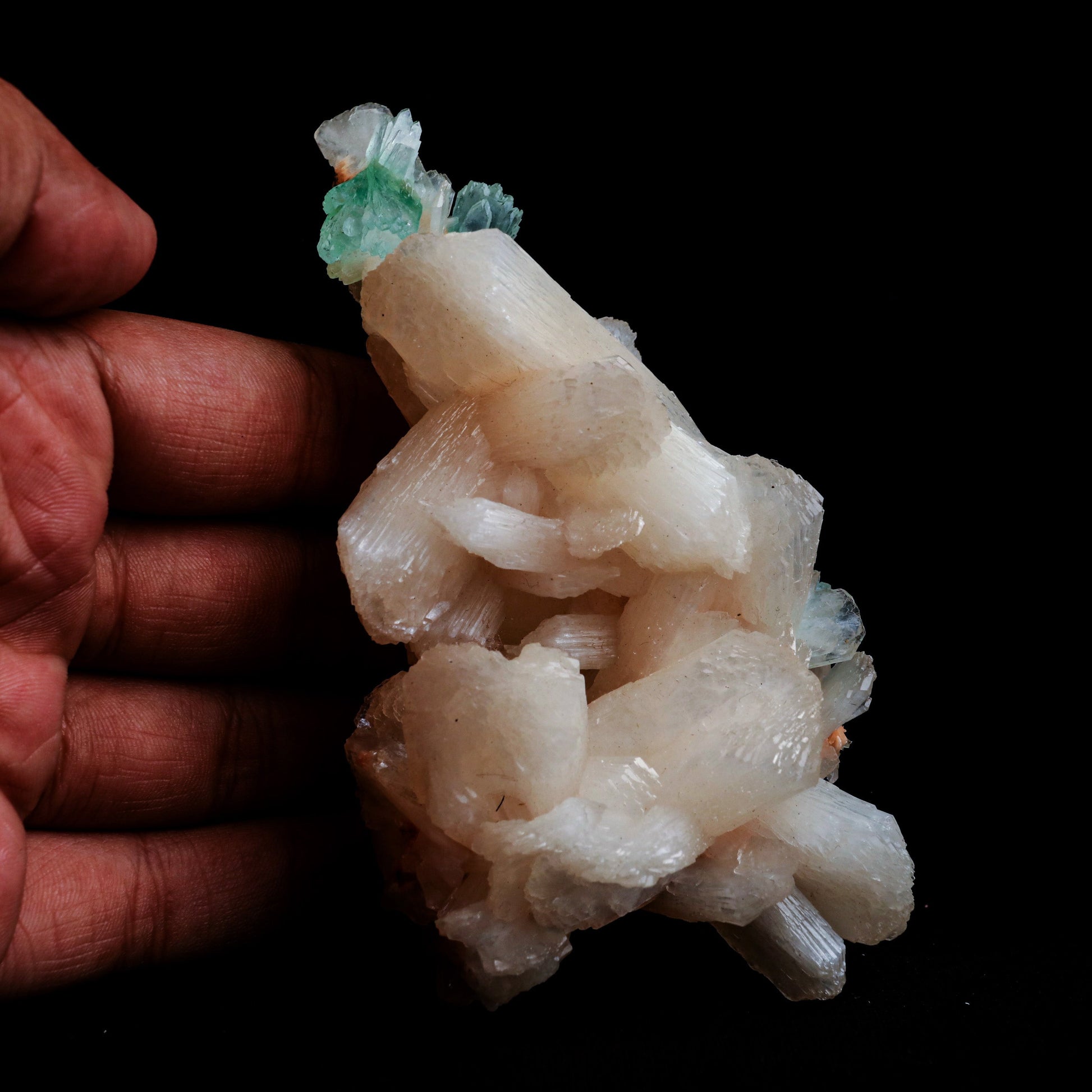 Green Apophyllite with Stilbite Natural Mineral Specimen # B 5056  https://www.superbminerals.us/products/green-apophyllite-with-stilbite-natural-mineral-specimen-b-5056  Features: Transparent green apophyllite crystals long with lustrous crystal faces and steep pyramidal terminations on matrix coated with lustrous peach-baggie coloured Stilbite crystals of 