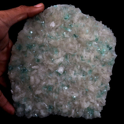 Green Apophyllite with Stilbite, Powellite Rare Find Natural Mineral S…  https://www.superbminerals.us/products/green-apophyllite-sprakling-crystals-with-stilbite-natural-mineral-specimen-b-4767  Features: We have a striking crystal perched elegantly in apophyllite and stilbite crystal nests that are elongated and dramatic! This is a noteworthy specimen in terms of the powellite's own size and the combination's overall appearance. The crystal is a double-terminated, transparent, satiny powellite crystal 