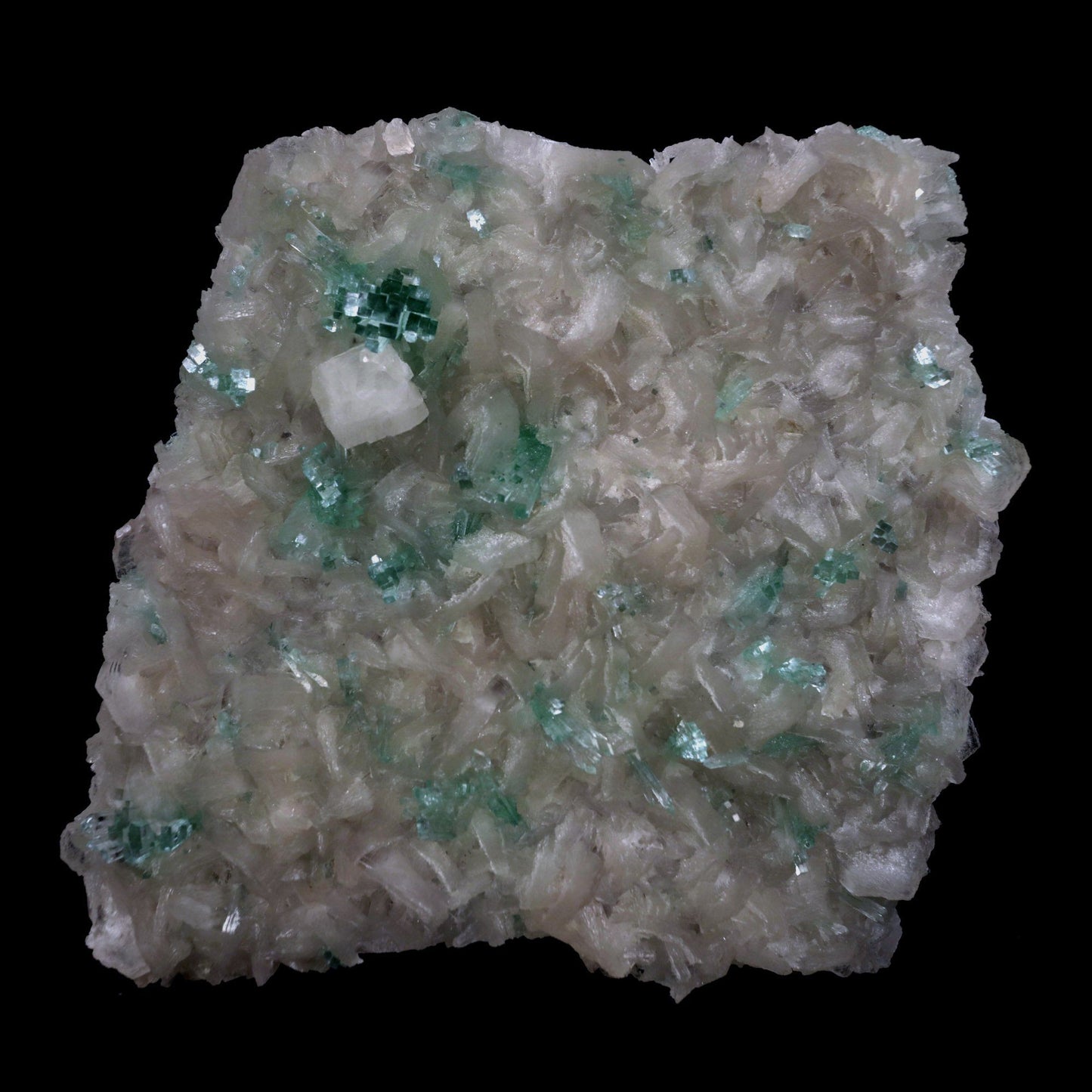 Green Apophyllite with Stilbite, Powellite Rare Find Natural Mineral S…  https://www.superbminerals.us/products/green-apophyllite-with-stilbite-powellite-rare-find-natural-mineral-specimen-b-4768  Features: We have a striking crystal perched elegantly in apophyllite and stilbite crystal nests that are elongated and dramatic! This is a noteworthy specimen in terms of the powellite's own size and the combination's overall appearance. The crystal is a double-terminated, transparent, satiny powellite crystal 