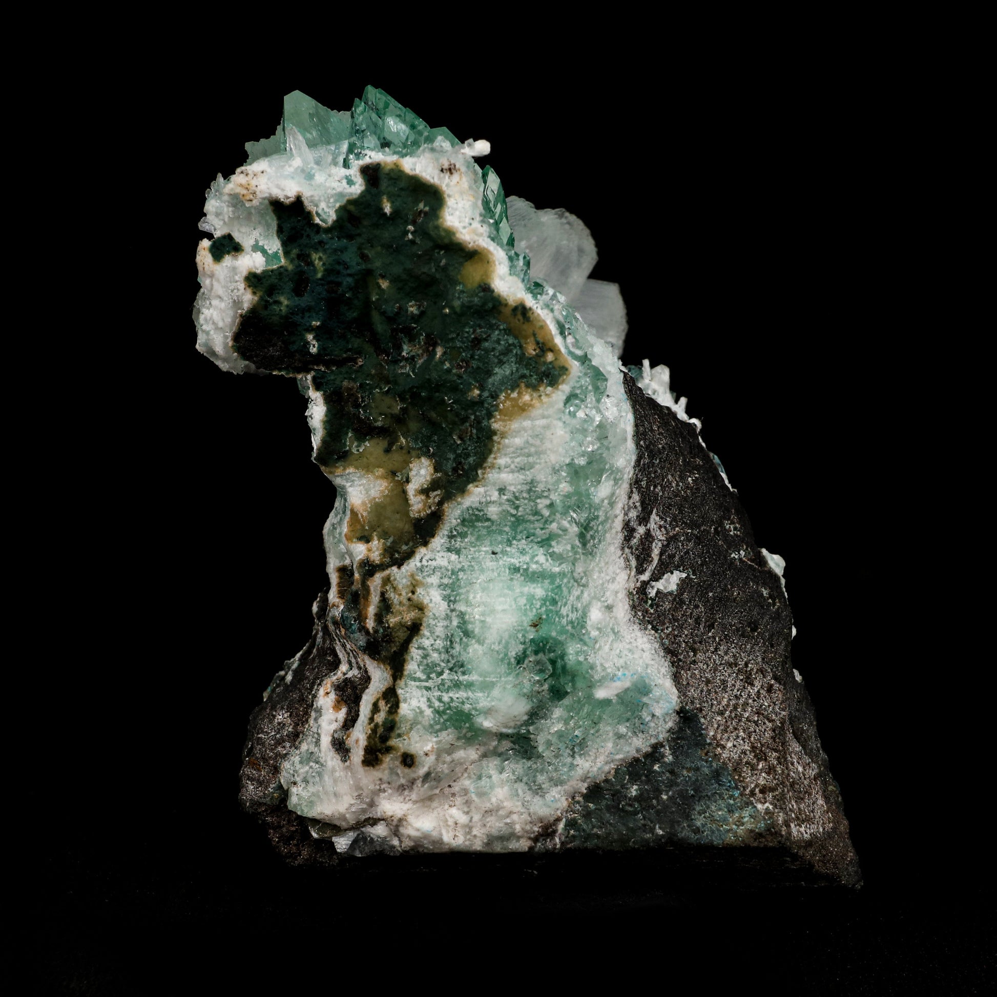 Green Fluorapophyllite and Stilbite Natural Mineral Specimen # B 507…  https://www.superbminerals.us/products/green-apophyllite-with-stilbite-natural-mineral-specimen-b-5070  Features: A fine oldtimer from theQuarry of the style of some of the earliest gem apophyllites that came out, totally unique in style and unequaled today! On a basaltic matrix are rosette-like clusters of glassy and gemmy, mint-green fluorapophyllite, to&nbsp; in length. Several doubly terminated, lustrous 
