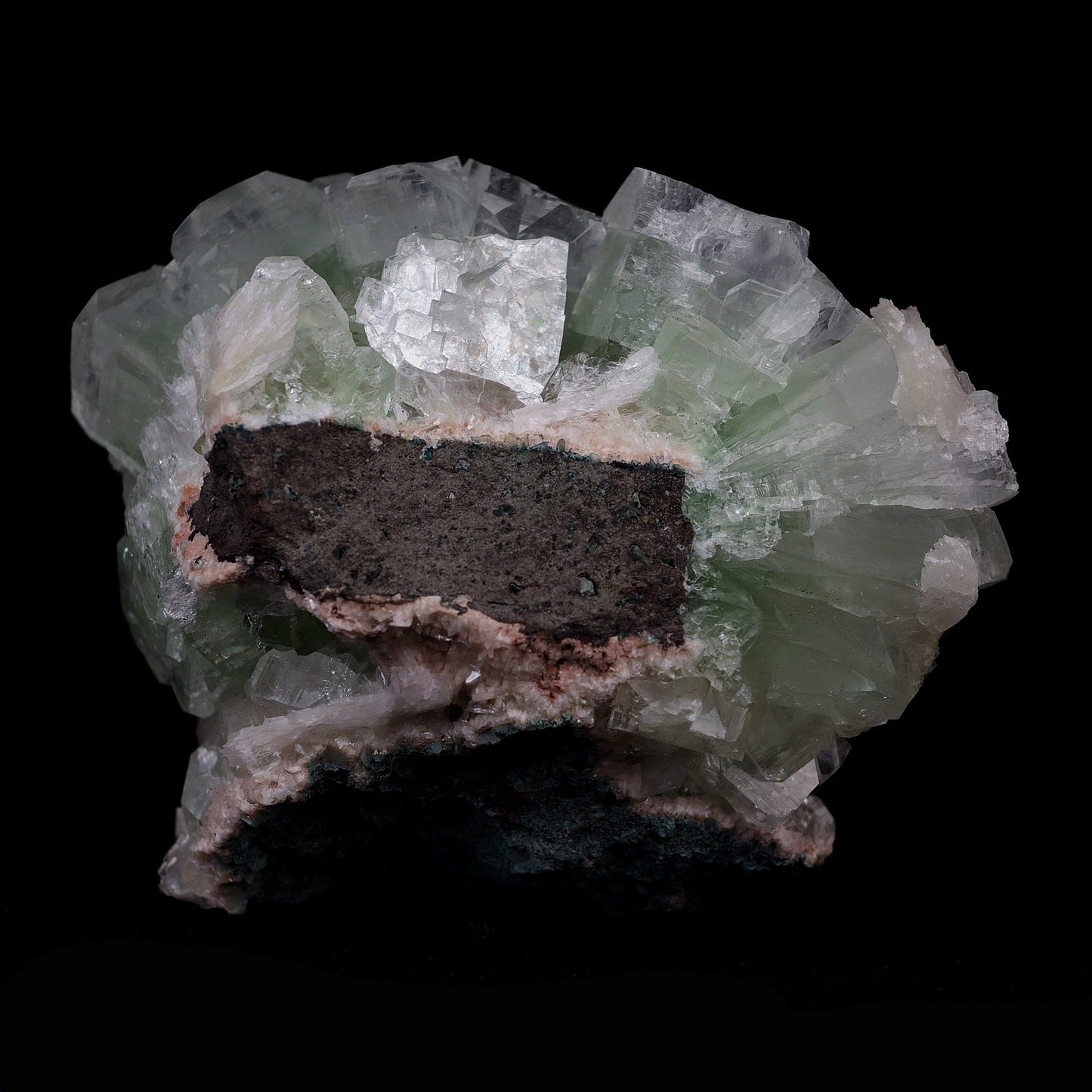 Green Fluroapophyllite with Stilbite Natural Mineral Specimen # B 4099  https://www.superbminerals.us/products/green-fluroapophyllite-with-stilbite-natural-mineral-specimen-b-4099  Features:From original recent find comes this specimen of Apophyllite displaying so called disco balls. The piece presents striking, lustrous, gem green to colorless Apophyllite-(kf) in bow tie shaped spray of cubically-tipped crystals. Some colorless and lustrous Stilbite crystals add a nice accent.