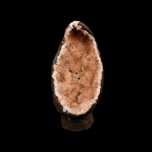 Helandite Geode Natural Mineral Specimen # B 5208  https://www.superbminerals.us/products/helandite-geode-natural-mineral-specimen-b-5208  Features: A nice aesthetic piece featuring a geode lined with lustrous, pink-orange Heulandite crystals. The crystals are well defined with a pearly, almost glassy luster. This piece sparkles. Excellent condition. Primary Mineral(s): HeulanditeSecondary Mineral(s): N/AMatrix: N/A 7 Inch x 3.5 InchWeight : 782 