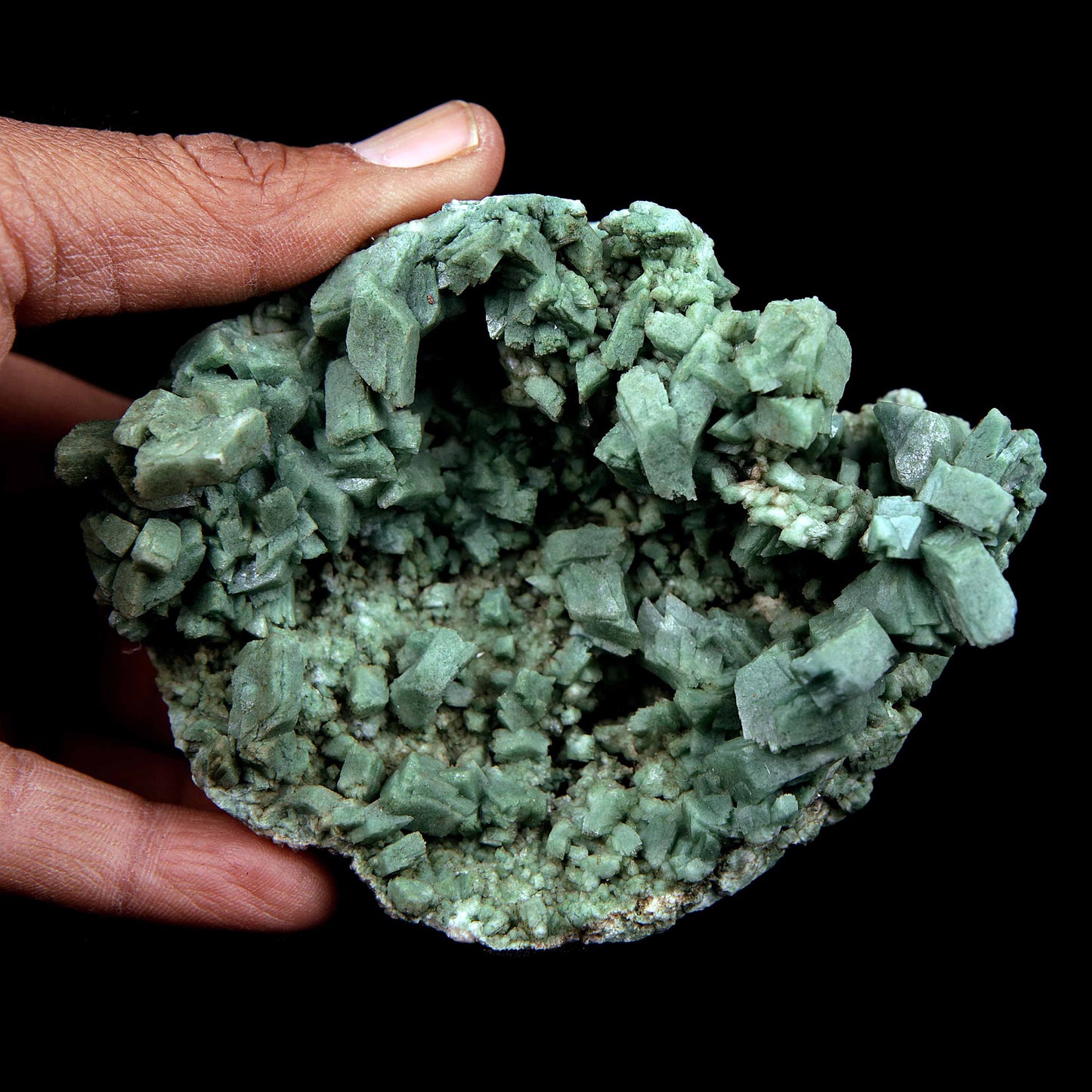 Heulandite Big Cluster Natural Mineral Specimen # B 3988  https://www.superbminerals.us/products/heulandite-big-cluster-natural-mineral-specimen-b-3988  Features Large cluster of lustrous translucent green heulandite crystals fully crystallized on all sides of the specimen with only thin attachment points. The heulandite crystals are colored green by microscopic celadonite inclusions and coating.
