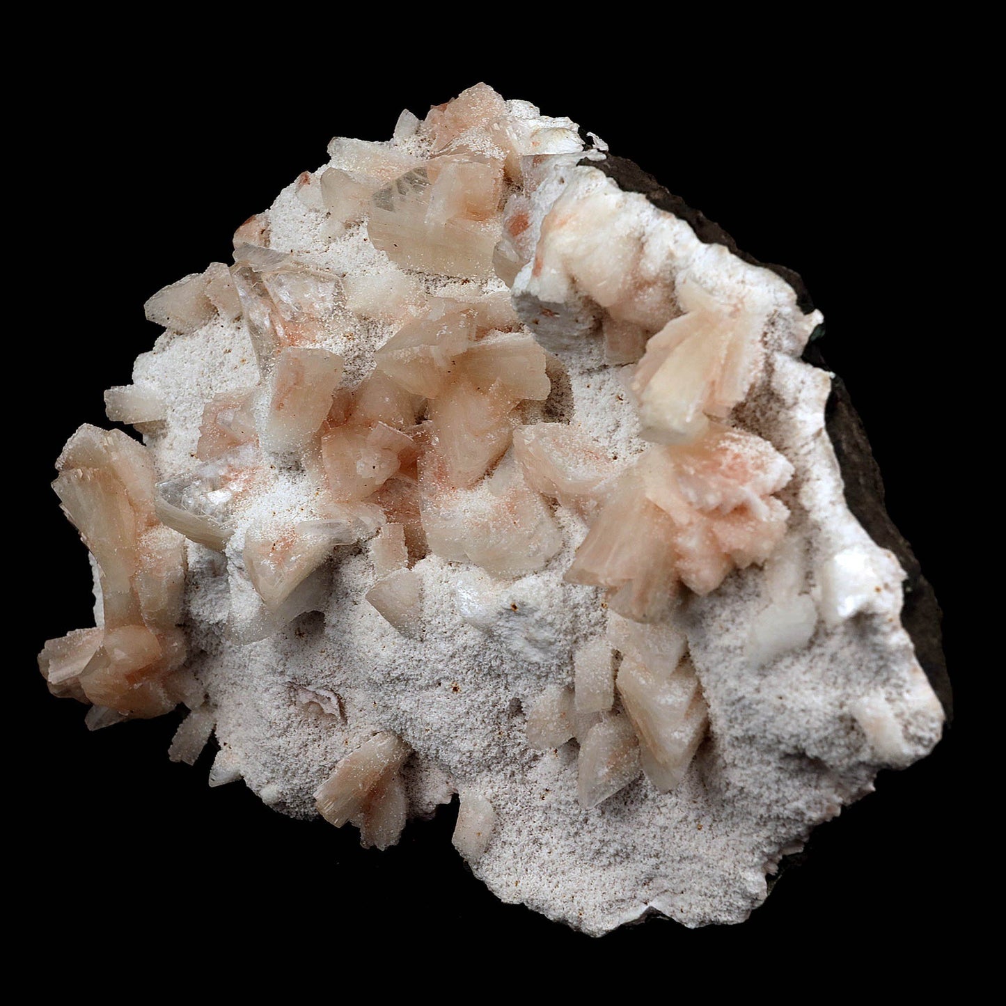 Heulandite crystals on Mordenite Natural Mineral Specimen # B 3722  https://www.superbminerals.us/products/heulandite-crystals-on-mordenite-natural-mineral-specimen-b-3722  Features:This neat specimen from India appears to be a combination of a heulandite crystal and chalcedony stalactites. Heulandite usually occurs in a very glossy pyramidal type crystal. This is a very nice specimen with no damage to the crystal. Peach colored crystals of heulandite on a white mordenite matrix. 